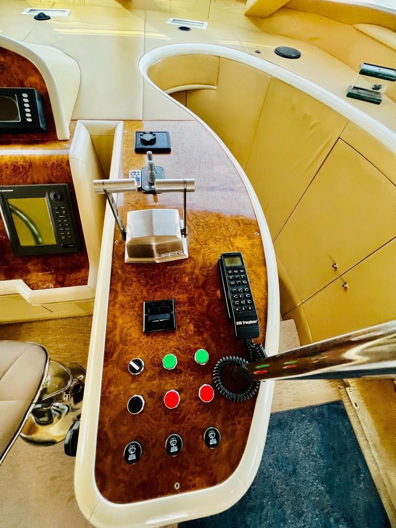a guitar on a wooden surface aboard MAGIC MOMENTS Yacht for Sale