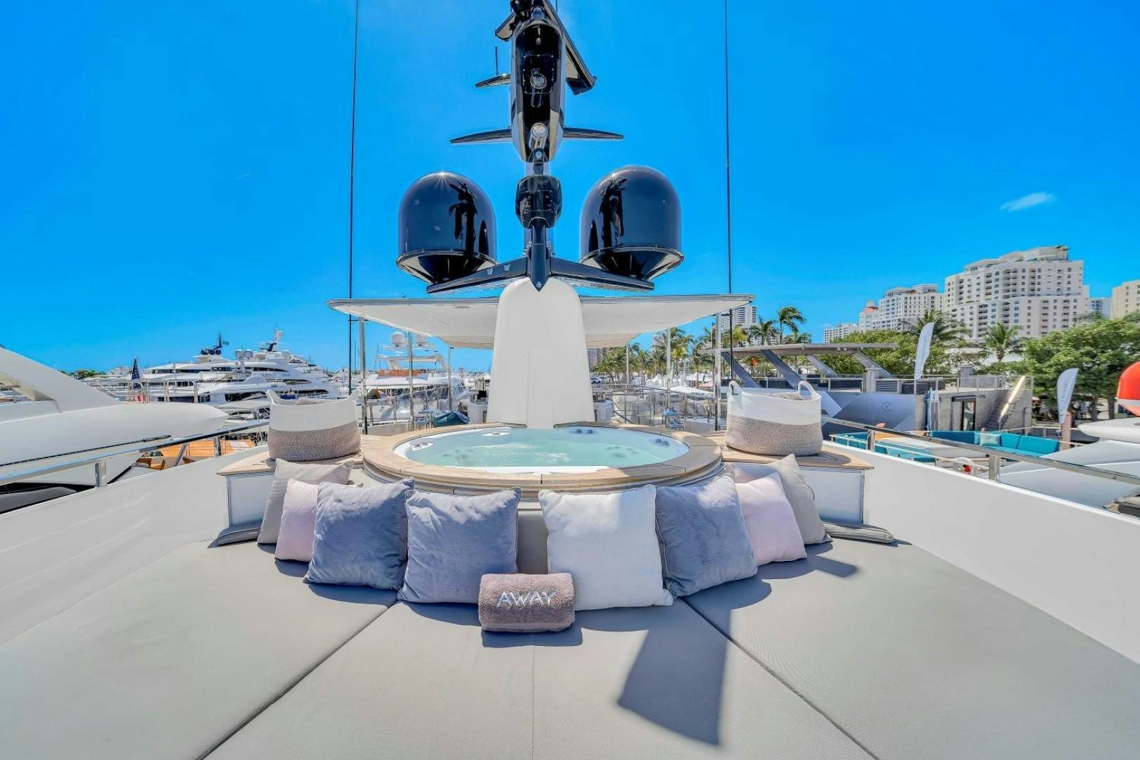 a large white fountain with a large round metal object on top aboard AWAY Yacht for Charter
