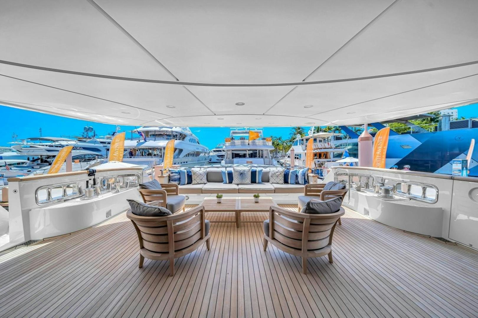 a room with a deck and a view of the water aboard AWAY Yacht for Charter