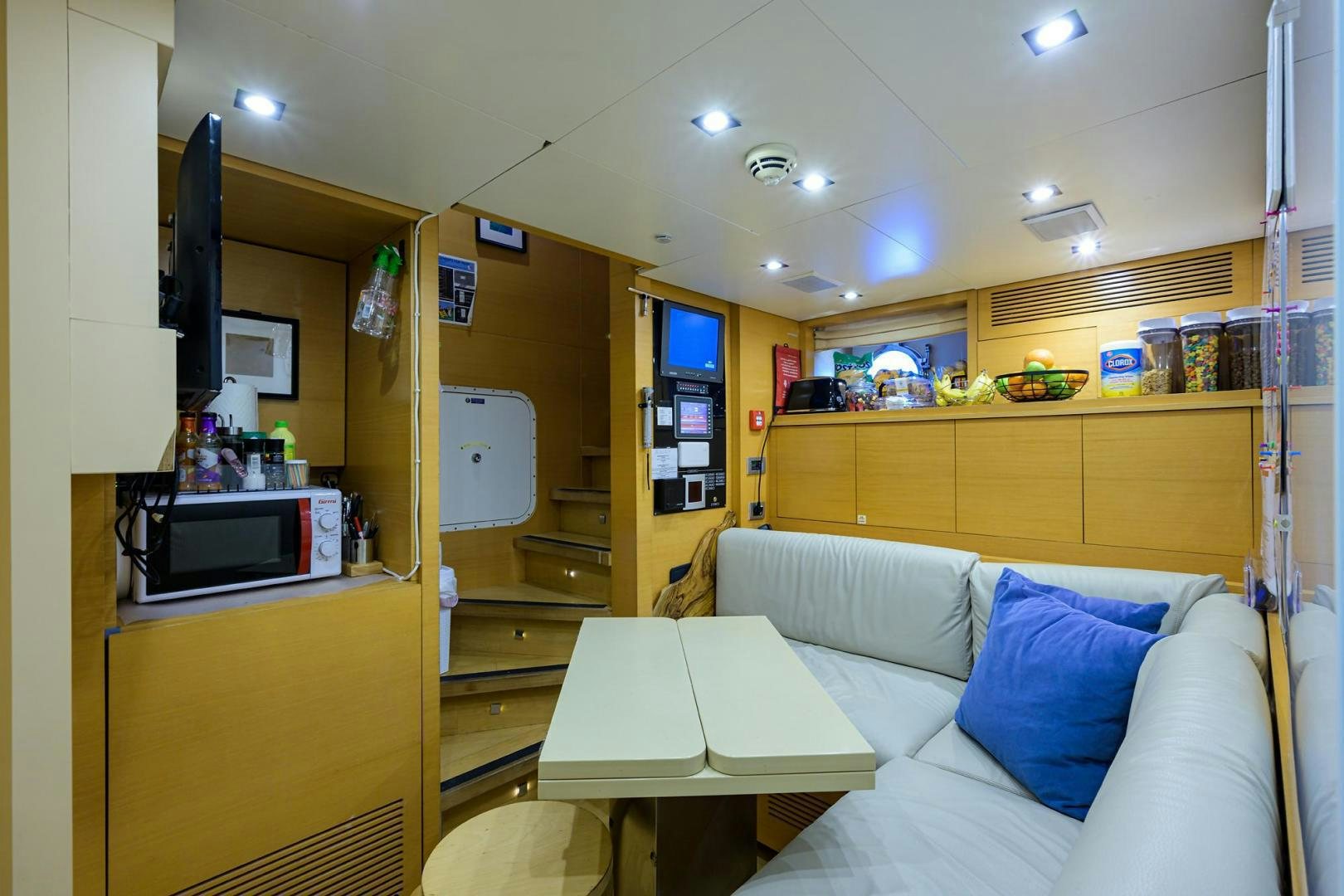 a room with a couch and a table aboard AWAY Yacht for Sale