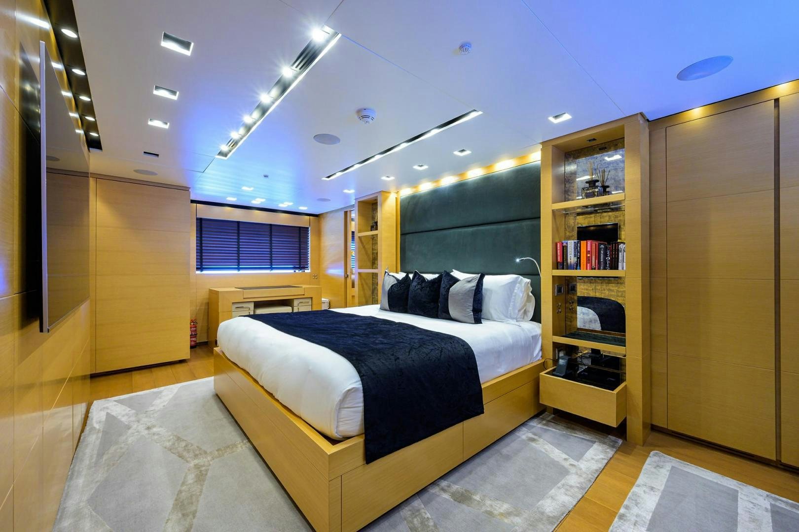 a bedroom with a large bed aboard AWAY Yacht for Sale