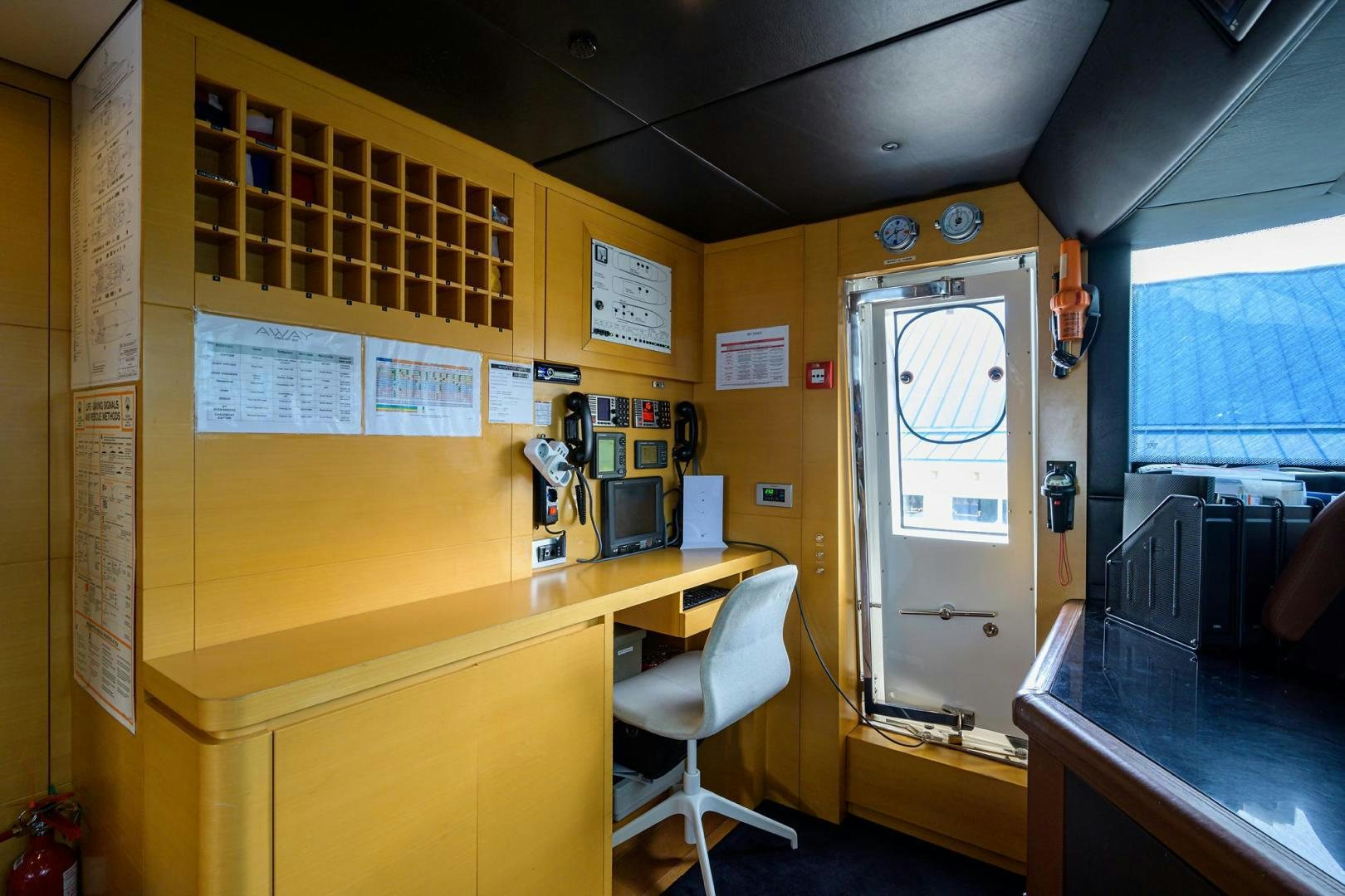 a room with desks and computers aboard AWAY Yacht for Sale