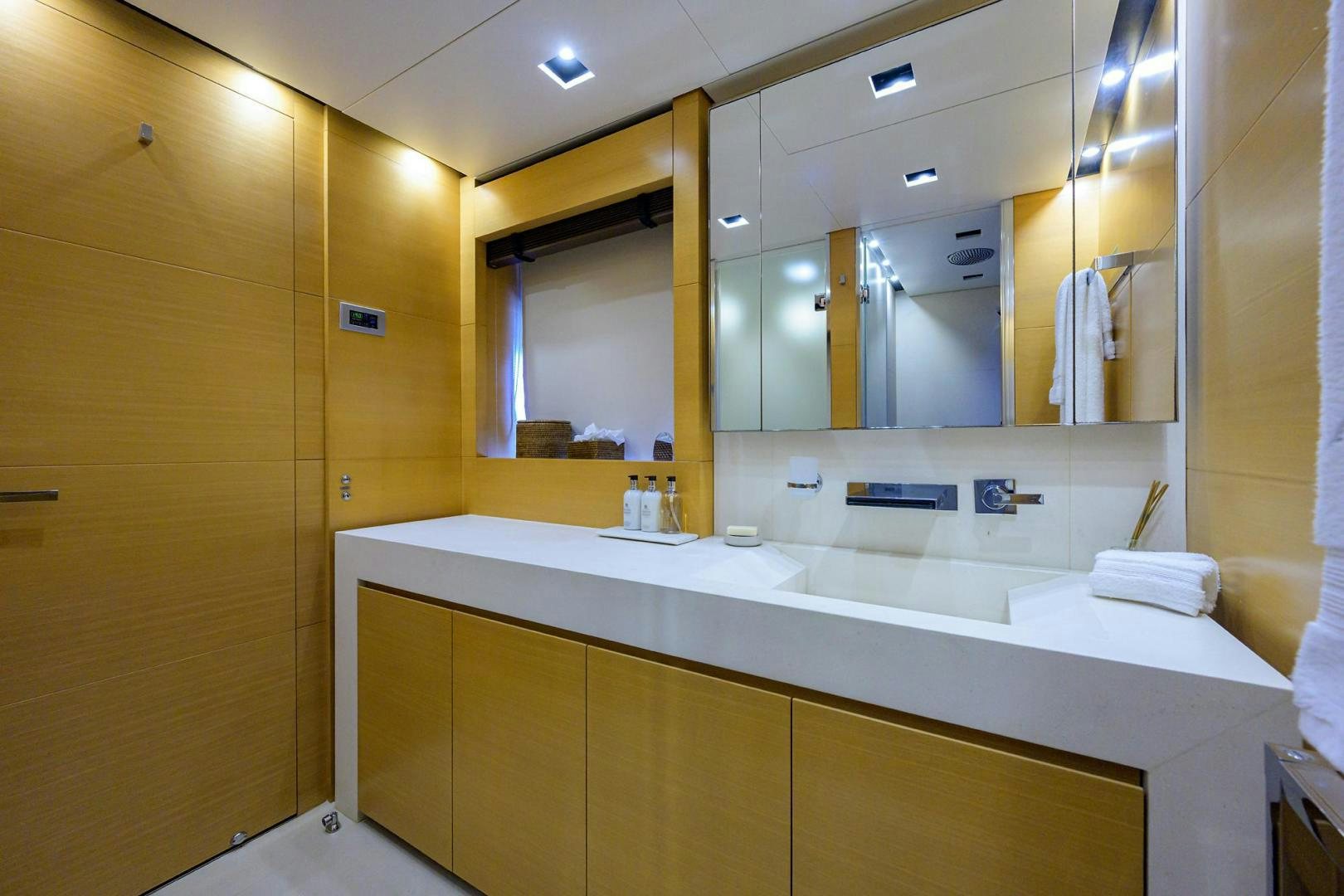 a bathroom with a large mirror aboard AWAY Yacht for Sale