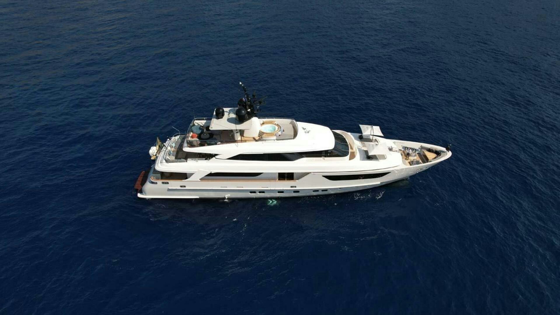 a white boat in the water aboard AWAY Yacht for Sale
