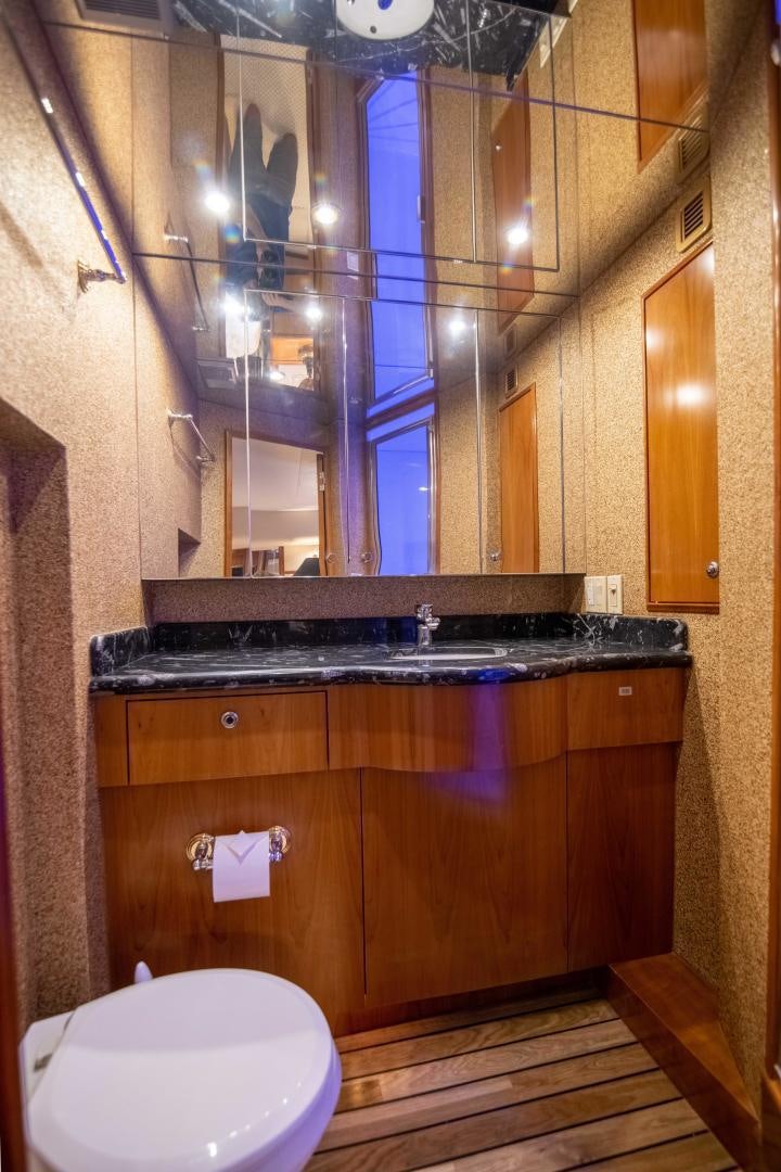 a bathroom with a sink and a toilet aboard IONA LOUISE Yacht for Sale