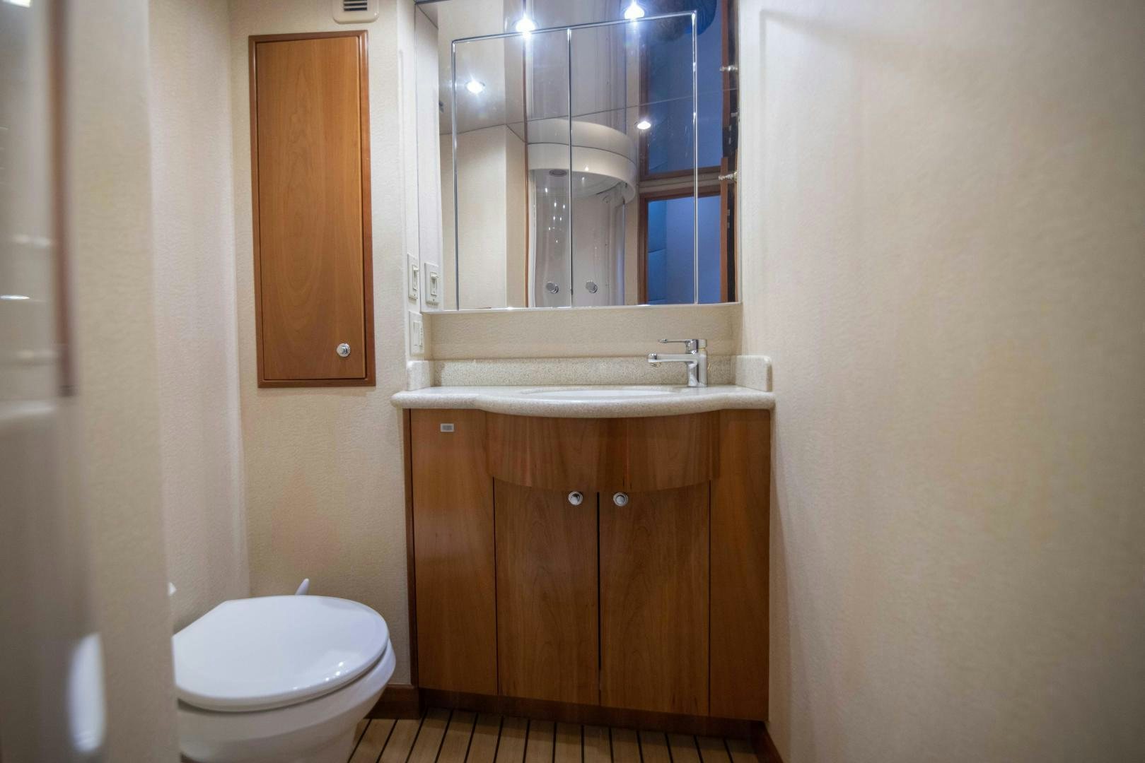 a bathroom with a sink and toilet aboard IONA LOUISE Yacht for Sale