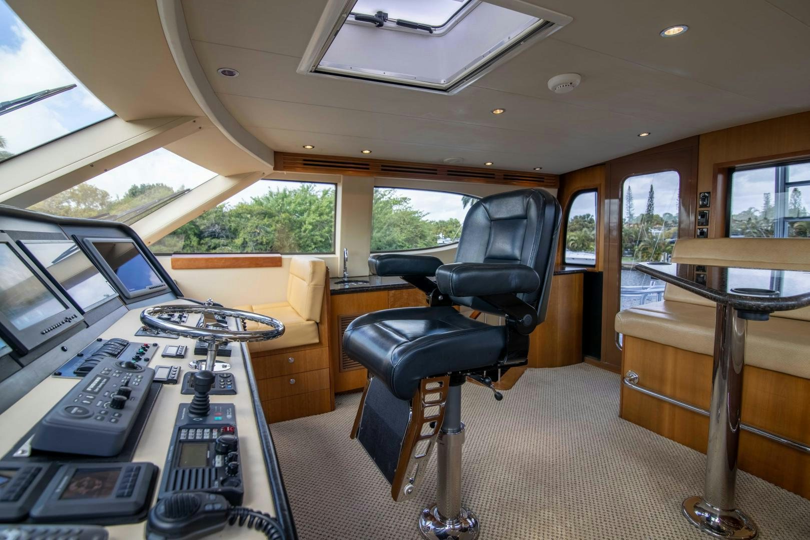 a car with a desk and a chair in the back aboard IONA LOUISE Yacht for Sale