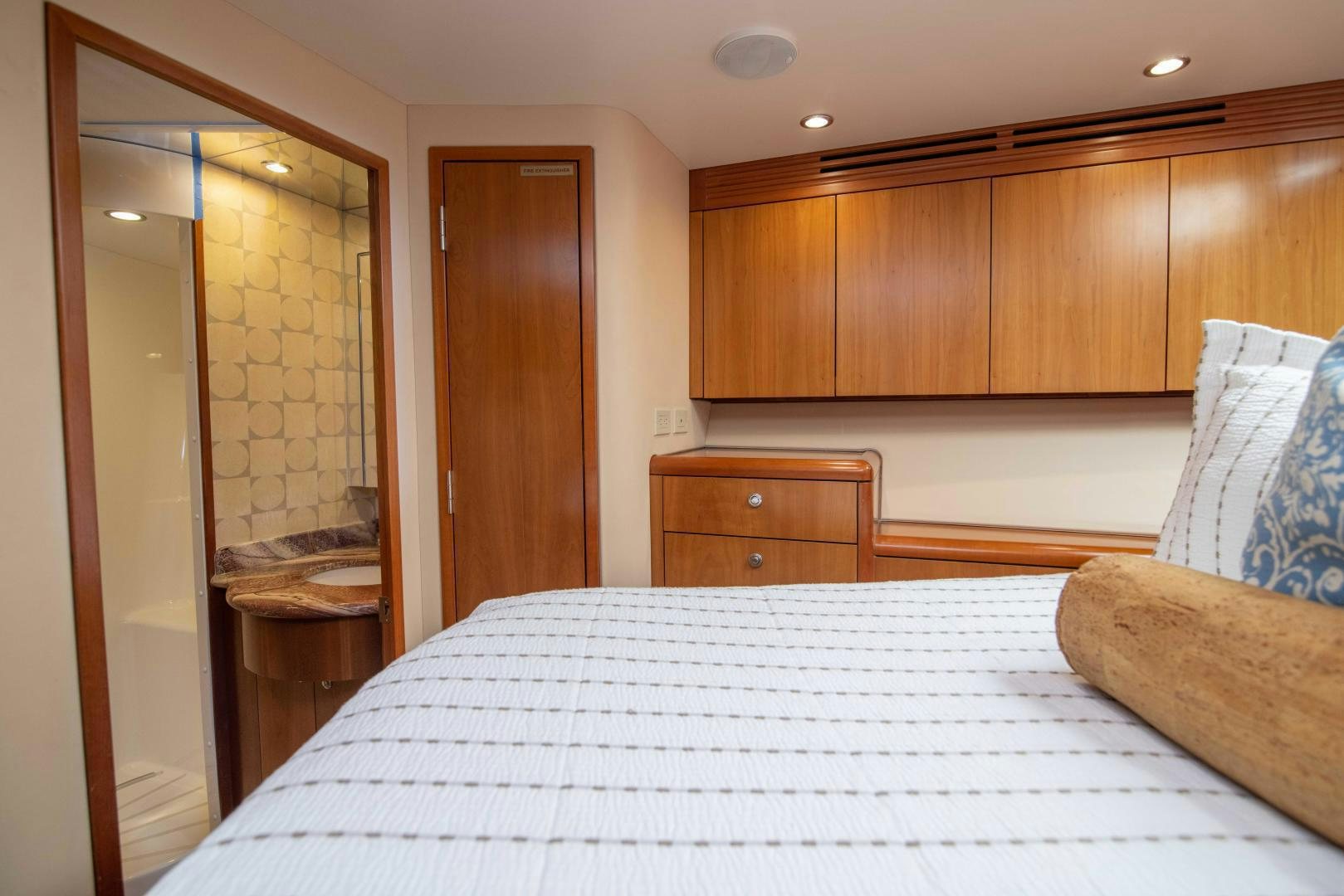 a large bedroom with a large bed aboard IONA LOUISE Yacht for Sale