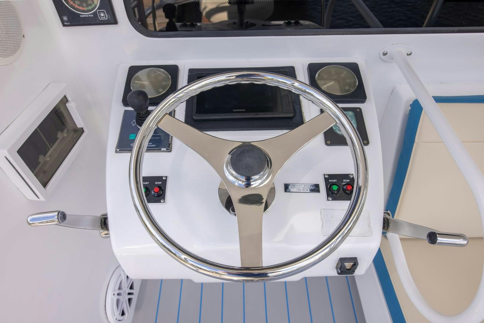 a white car with a steering wheel aboard IONA LOUISE Yacht for Sale