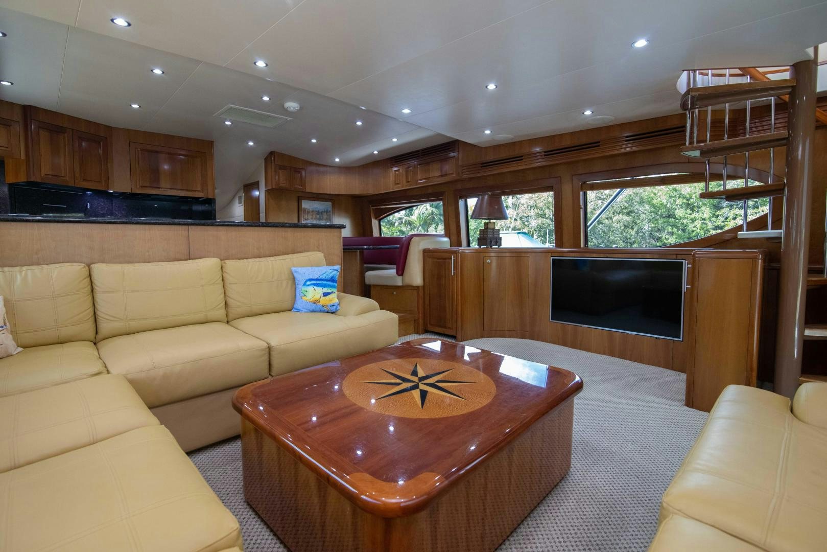 a living room with a fireplace aboard IONA LOUISE Yacht for Sale