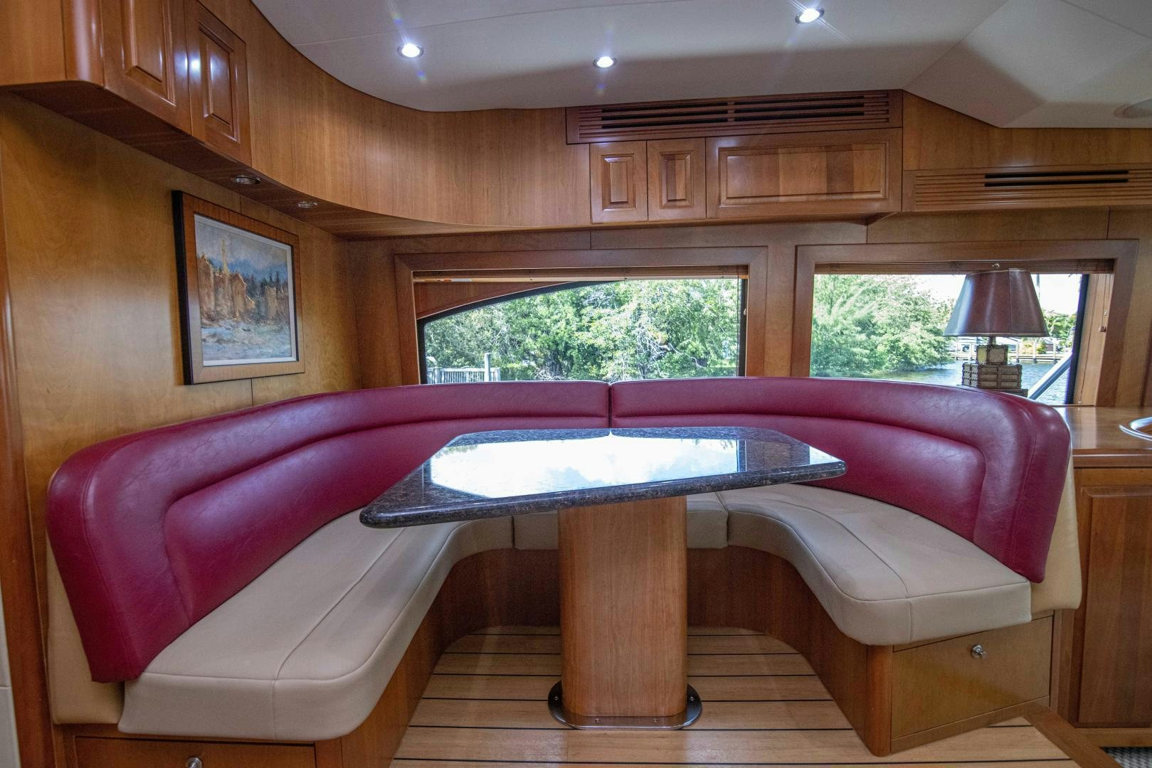 a room with a table and a pool table aboard IONA LOUISE Yacht for Sale