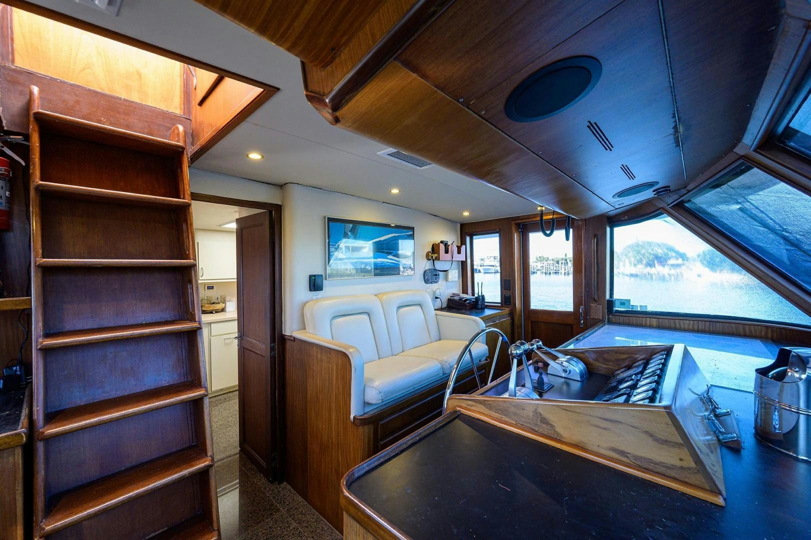 a cabin with a bed and a table aboard CHRISTIE LEE Yacht for Sale