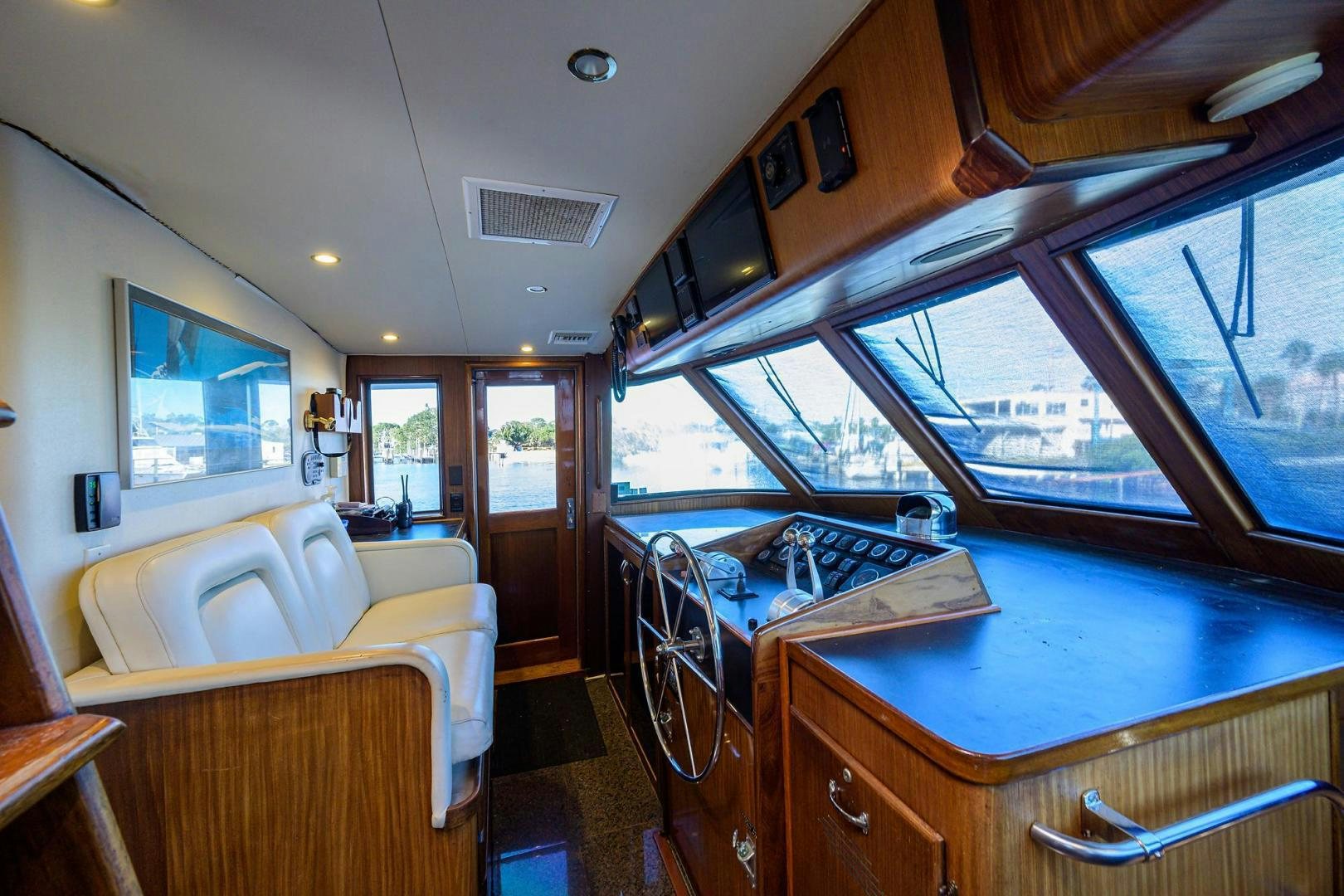 a room with a bed and a table aboard CHRISTIE LEE Yacht for Sale