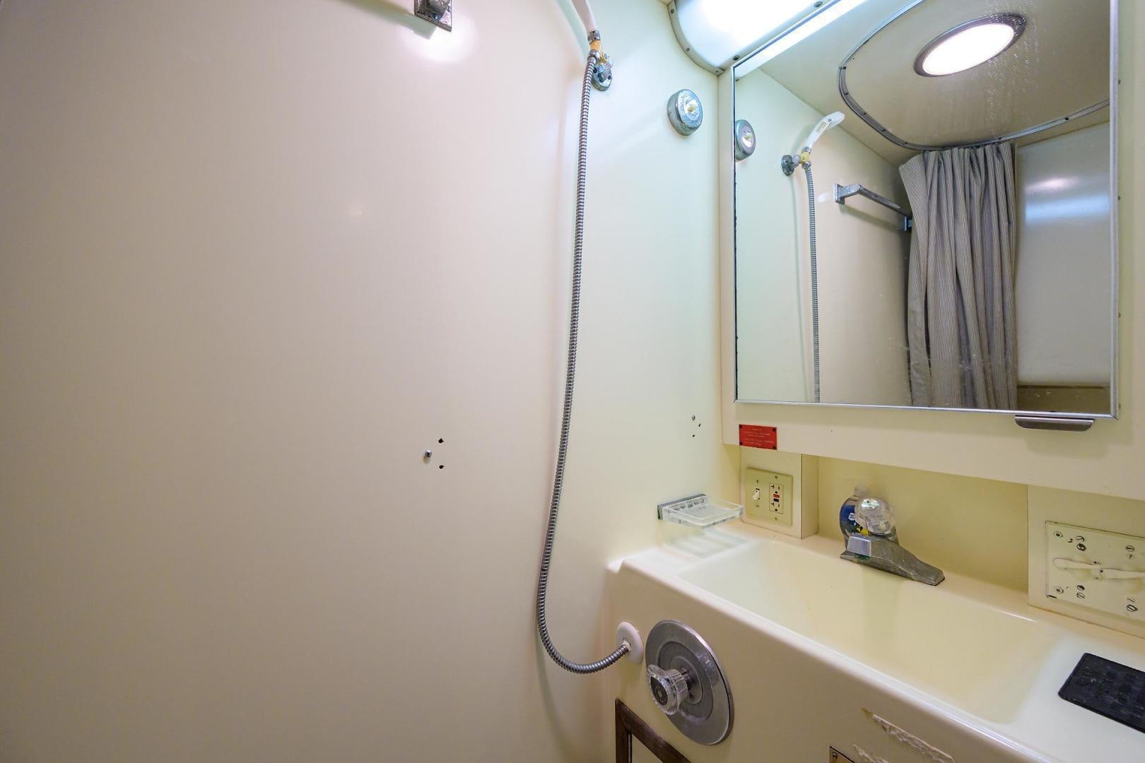 a bathroom with a mirror aboard CHRISTIE LEE Yacht for Sale