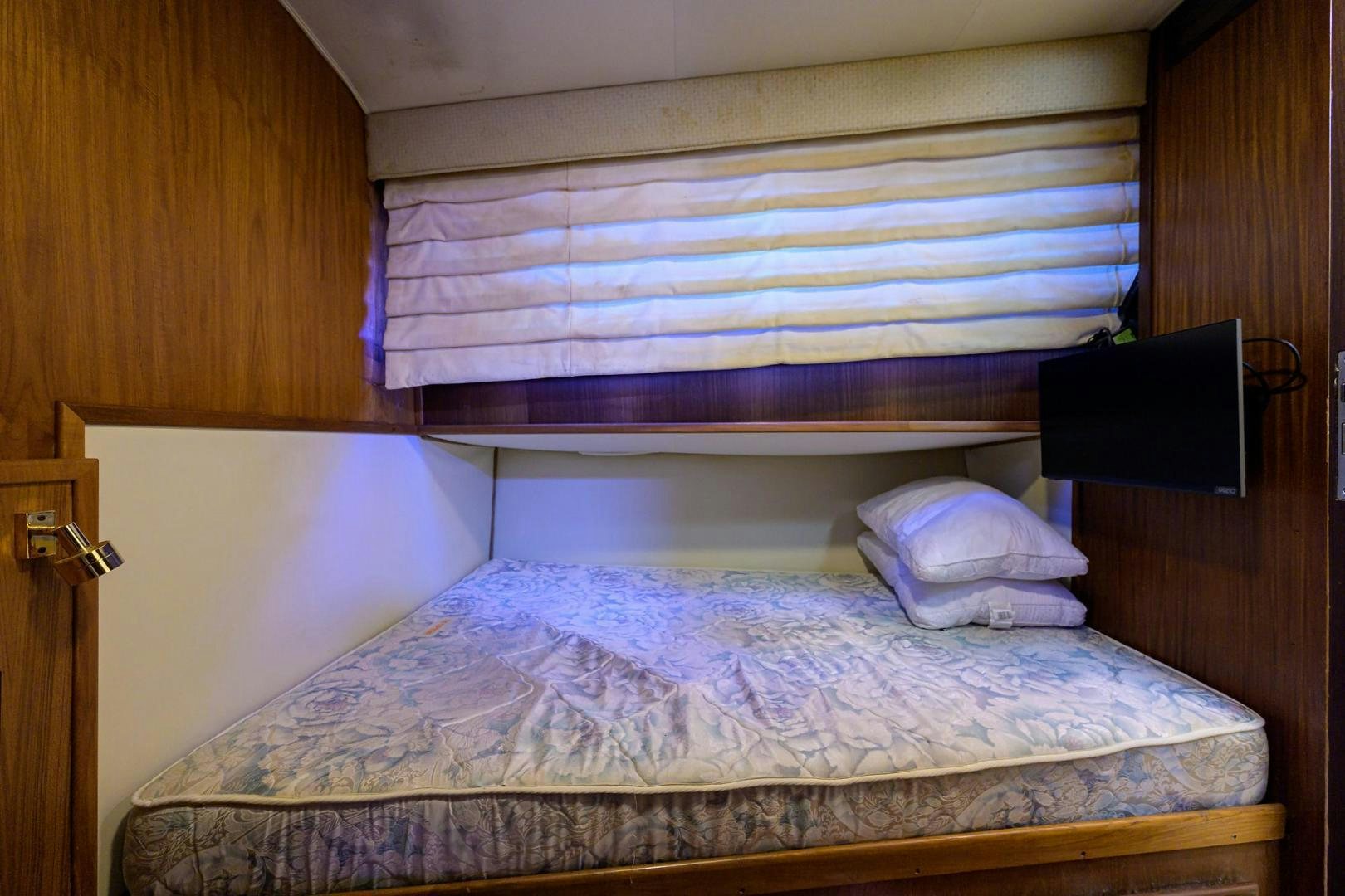 a bed with a white sheet aboard CHRISTIE LEE Yacht for Sale