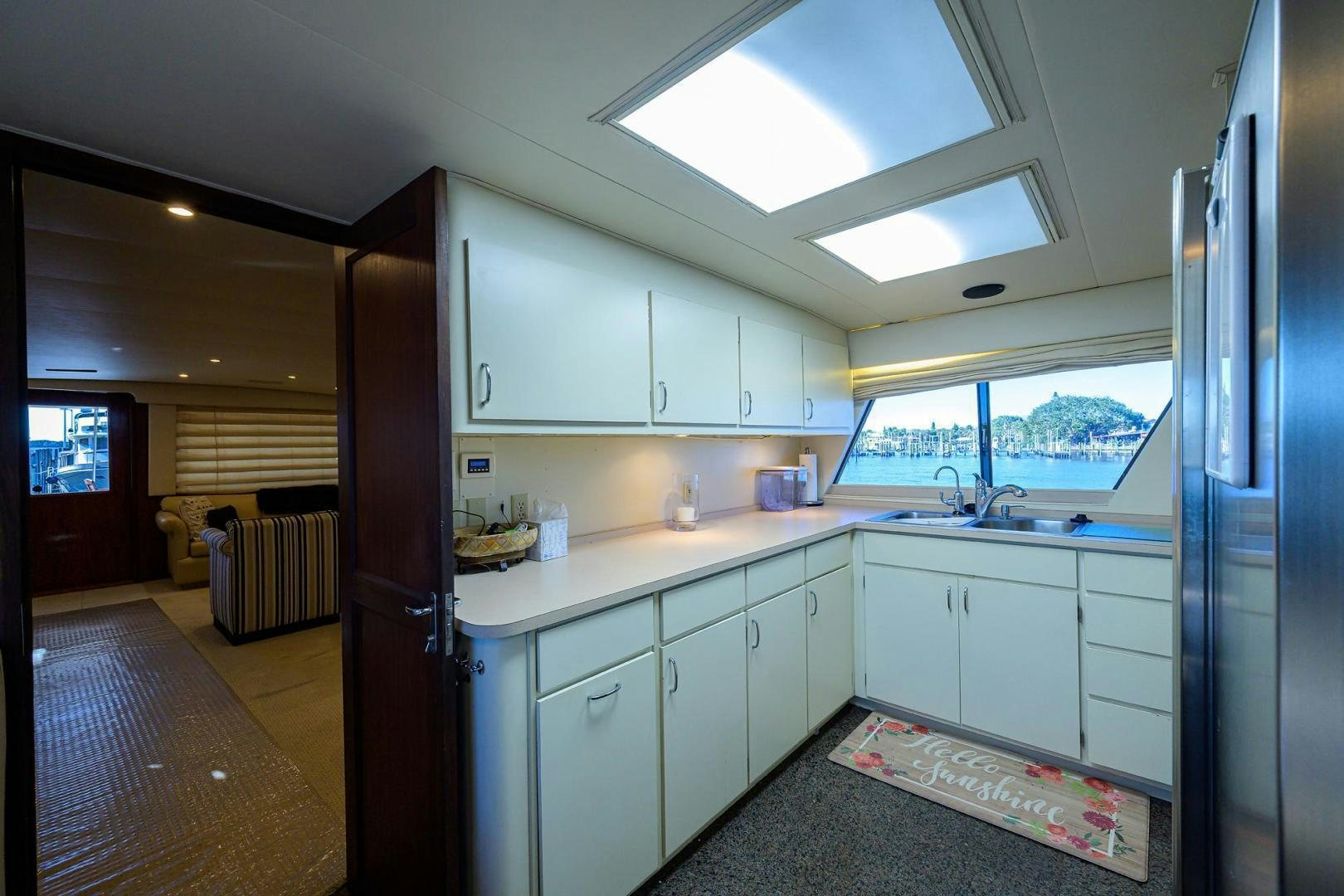 a kitchen with white cabinets aboard CHRISTIE LEE Yacht for Sale