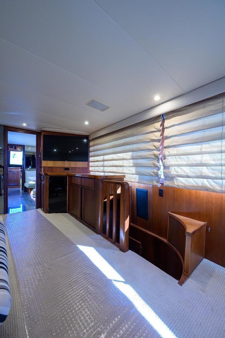 a long hallway with wood cabinets aboard CHRISTIE LEE Yacht for Sale
