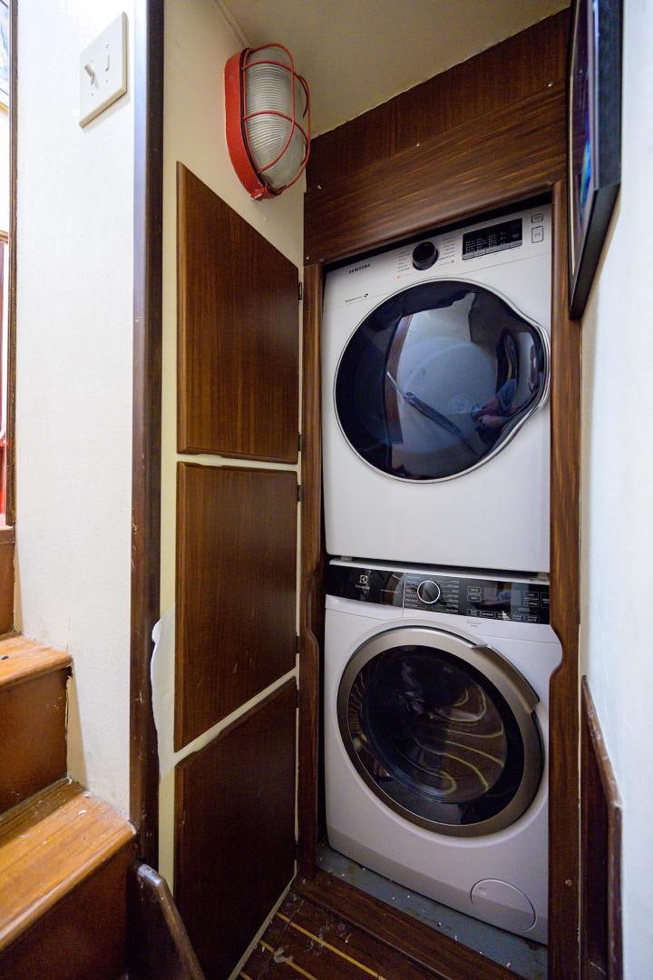 a washer and dryer in a room aboard CHRISTIE LEE Yacht for Sale