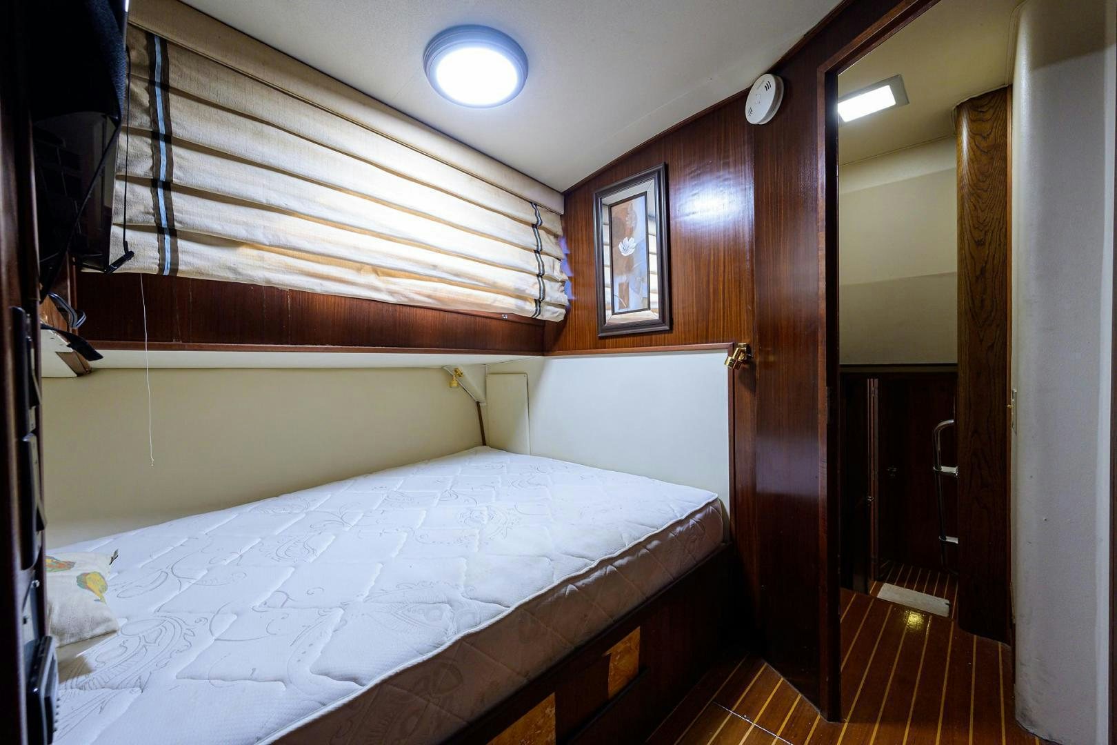 a room with a bed and a window aboard CHRISTIE LEE Yacht for Sale