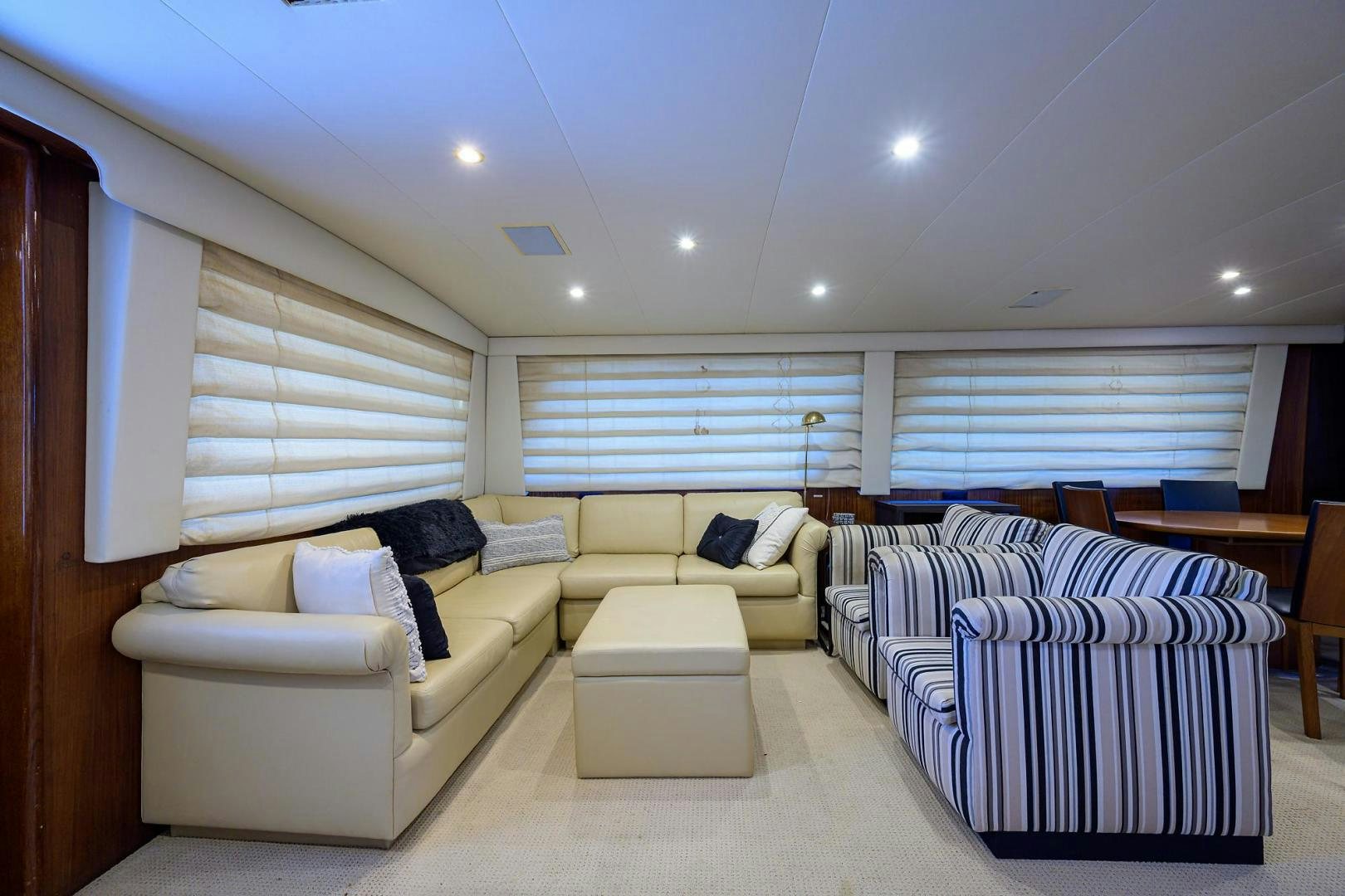 a living room with a couch and a table aboard CHRISTIE LEE Yacht for Sale