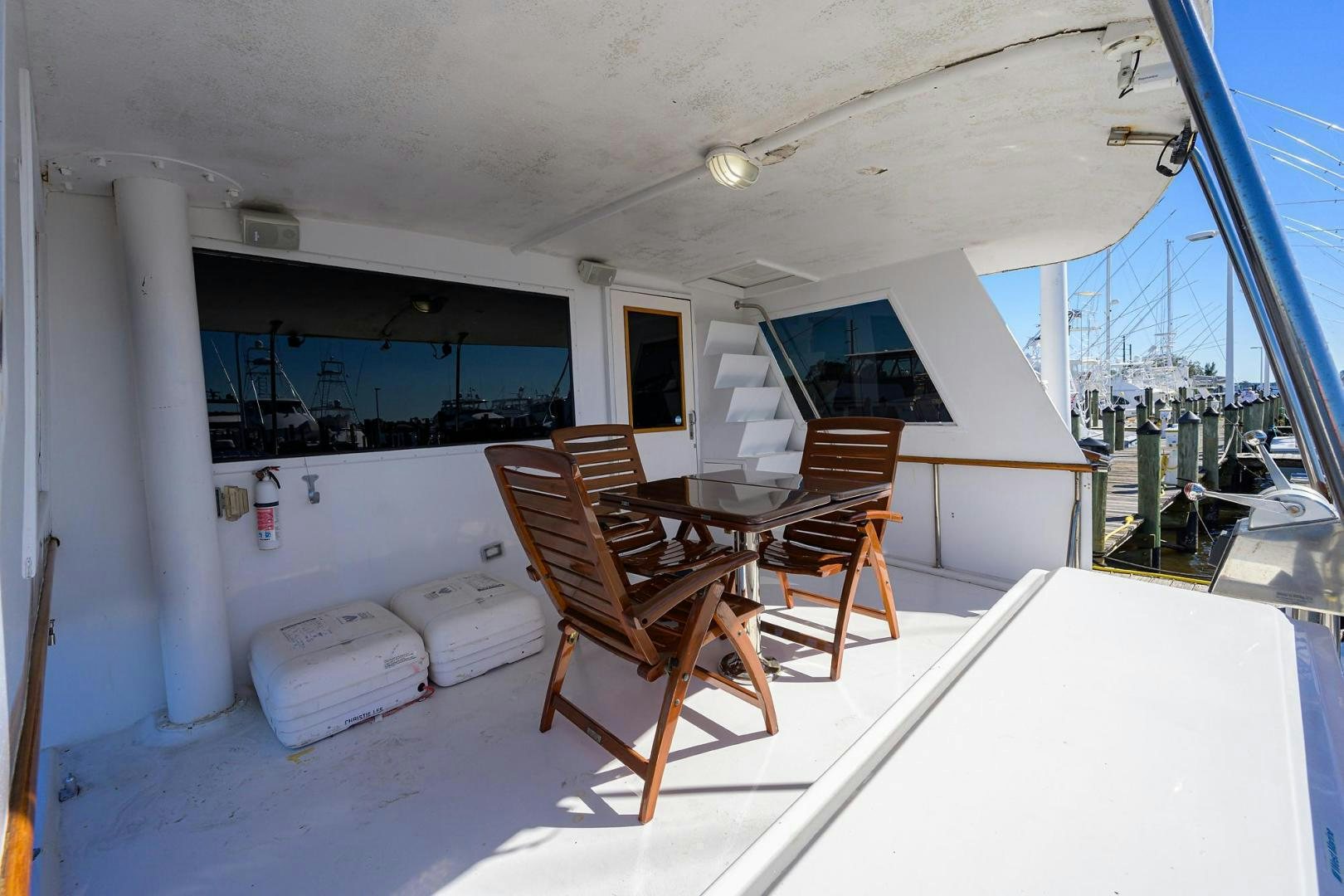 a room with a table and chairs aboard CHRISTIE LEE Yacht for Sale