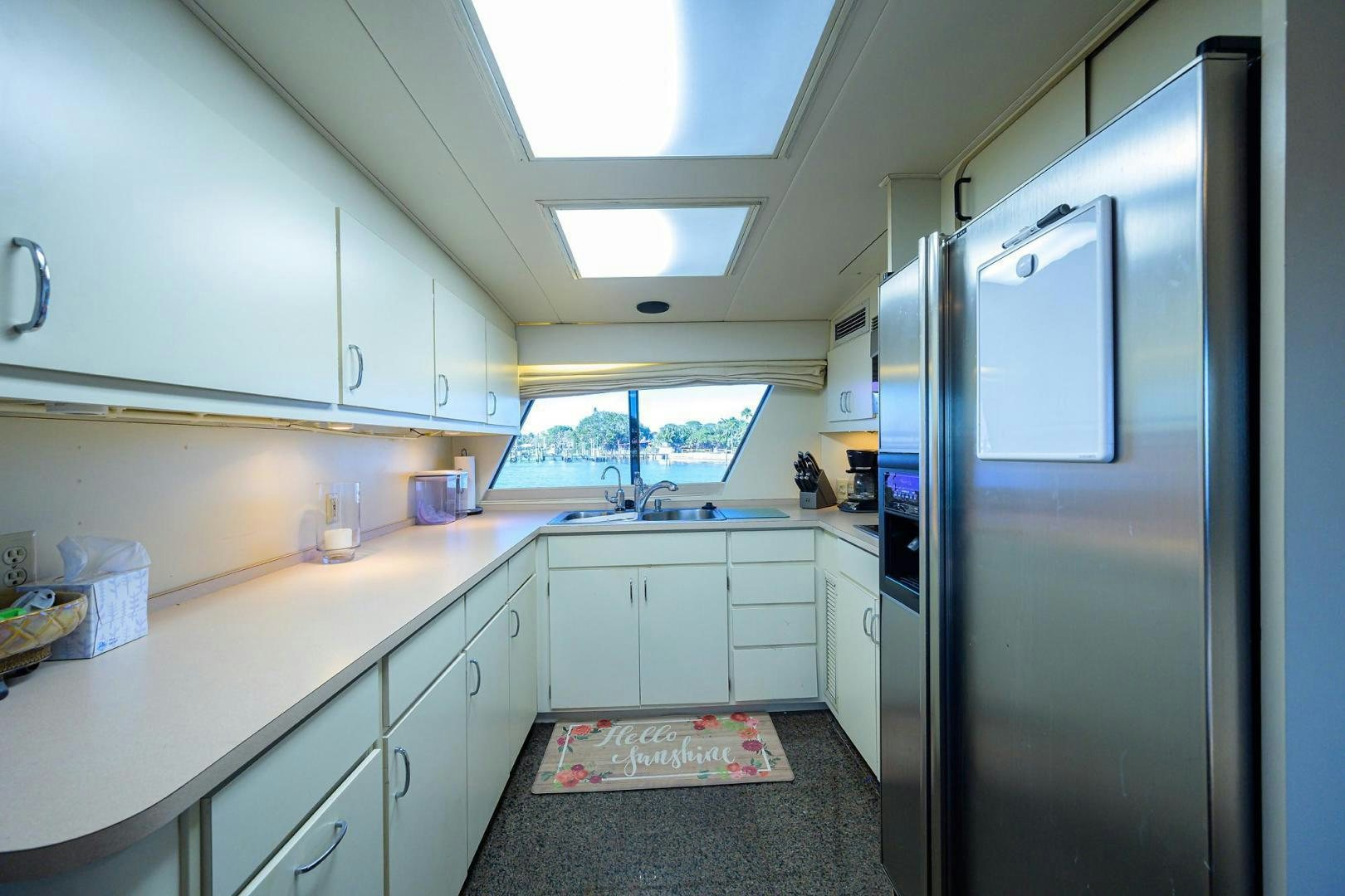 a kitchen with a fridge aboard CHRISTIE LEE Yacht for Sale