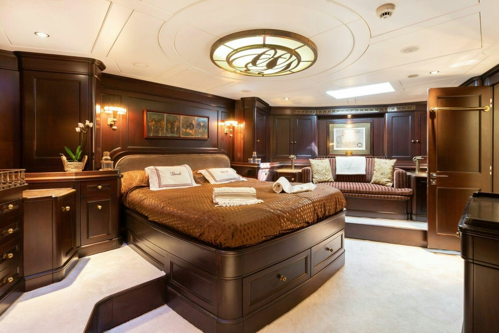 a large bedroom with a large bed aboard GWEILO Yacht for Sale