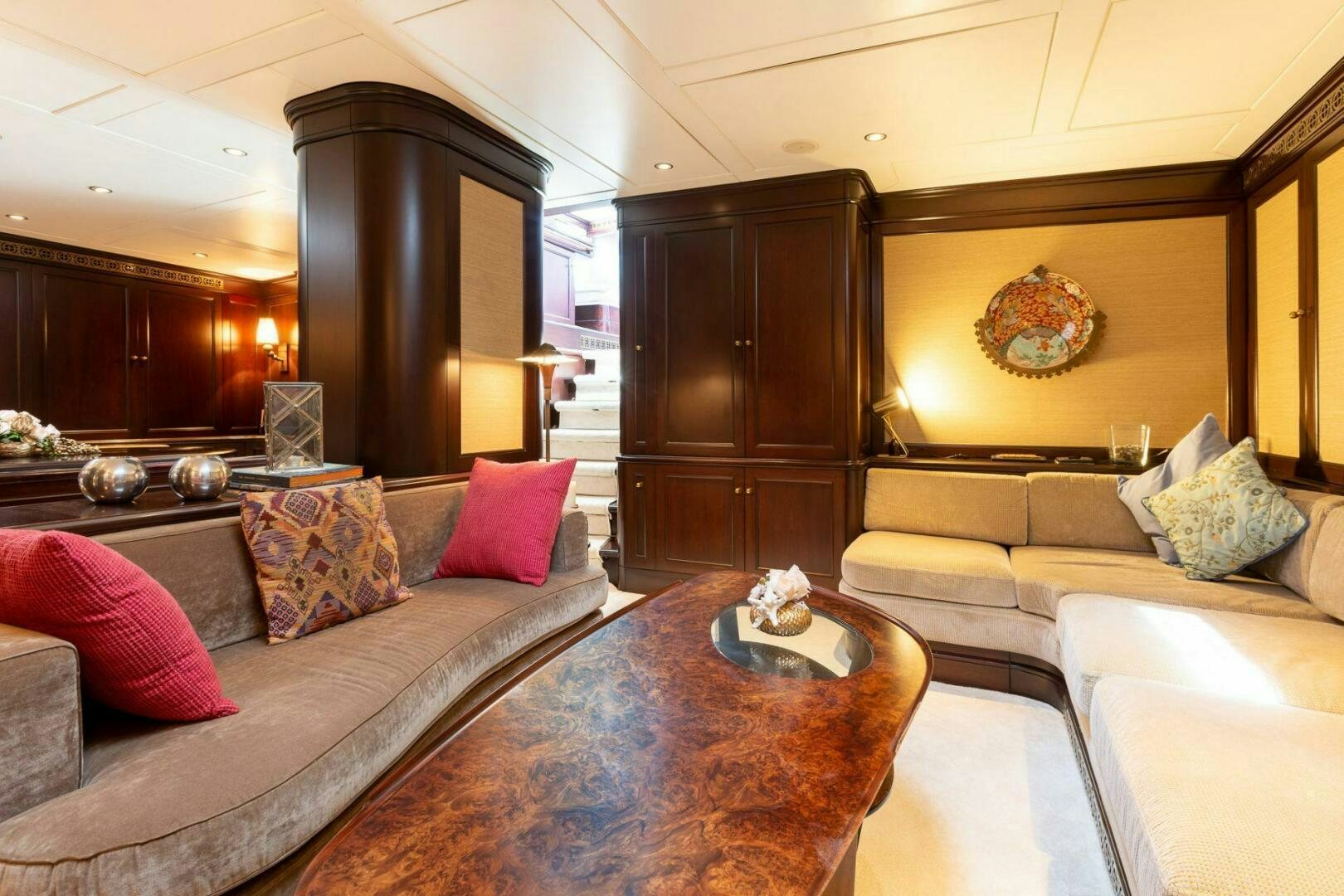 a living room with a couch and a coffee table aboard GWEILO Yacht for Sale