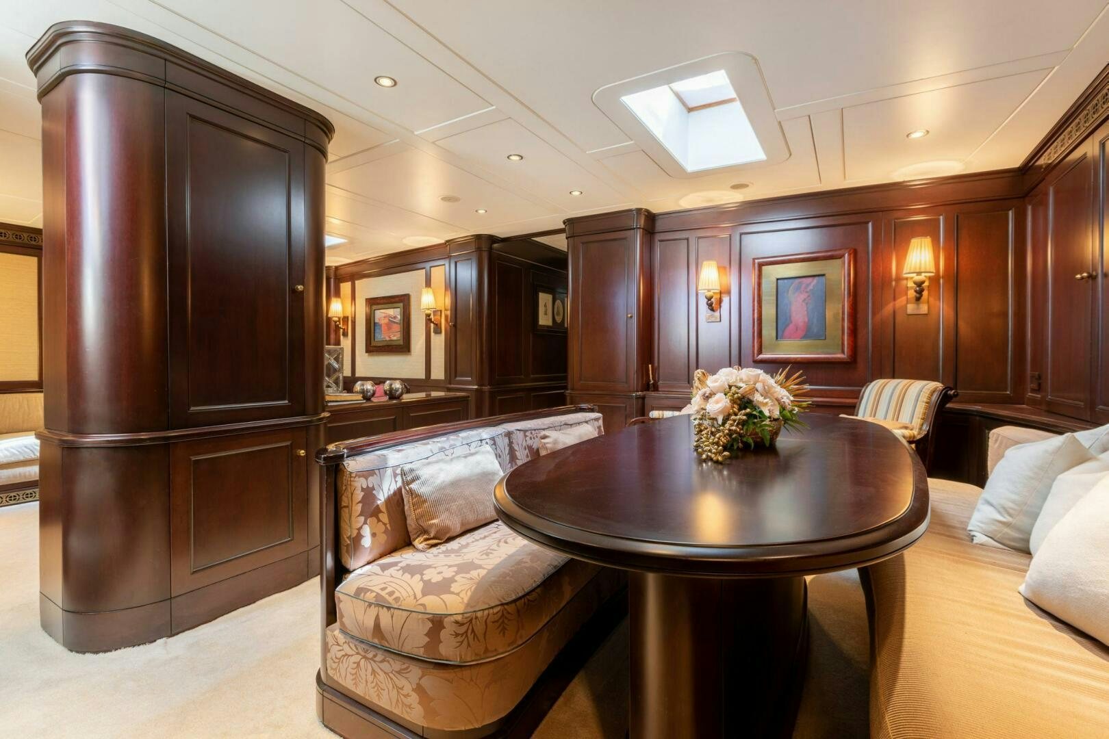 a living room with a leather chair aboard GWEILO Yacht for Sale