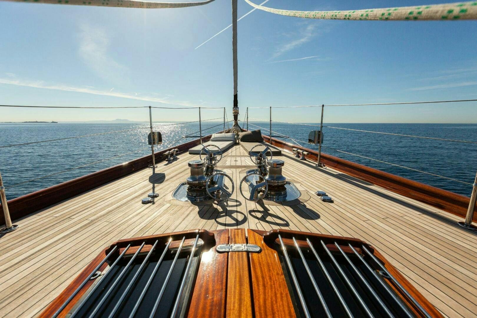 a deck with a large ship in the water aboard GWEILO Yacht for Sale