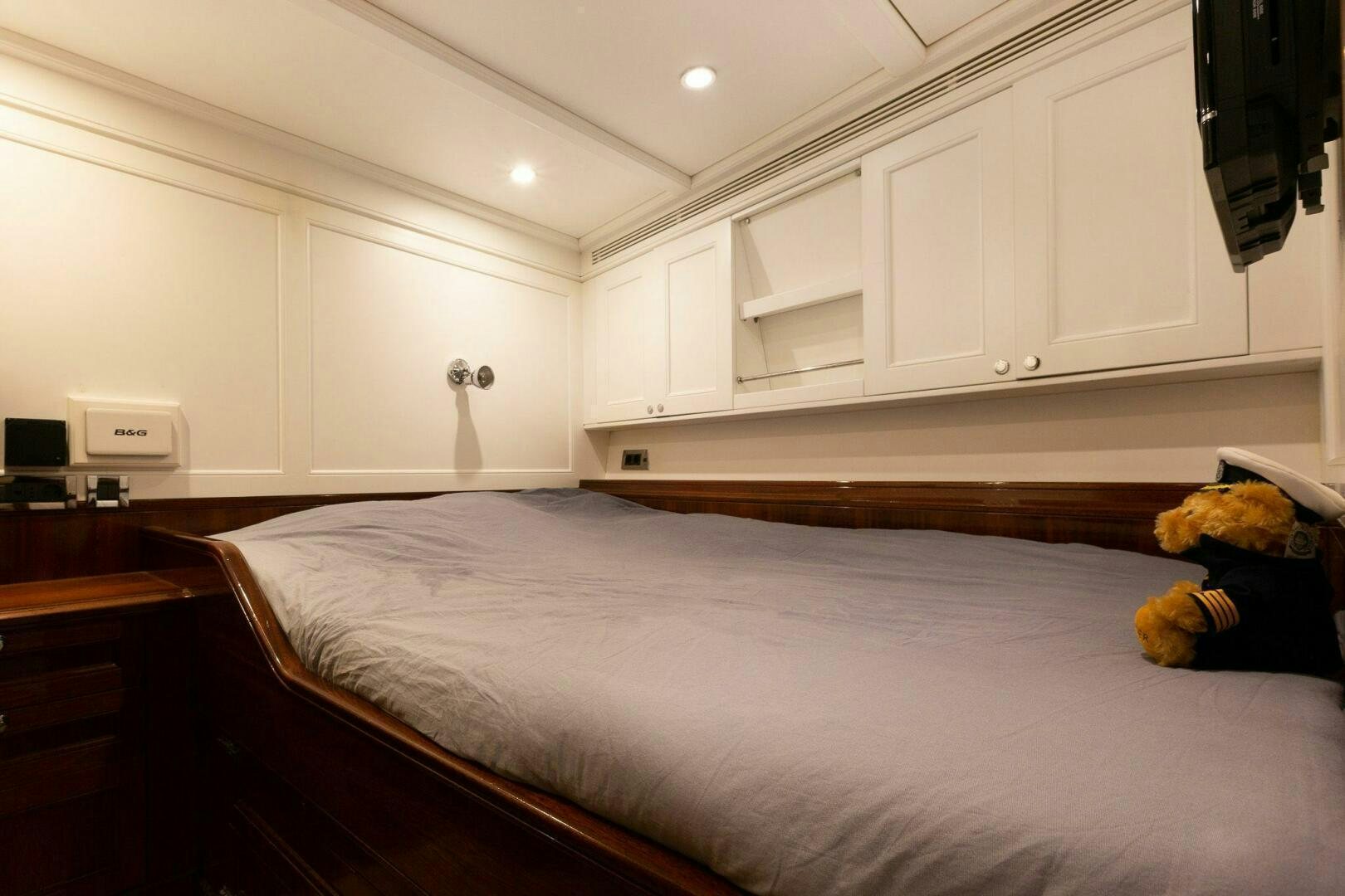 a child in a bedroom aboard GWEILO Yacht for Sale