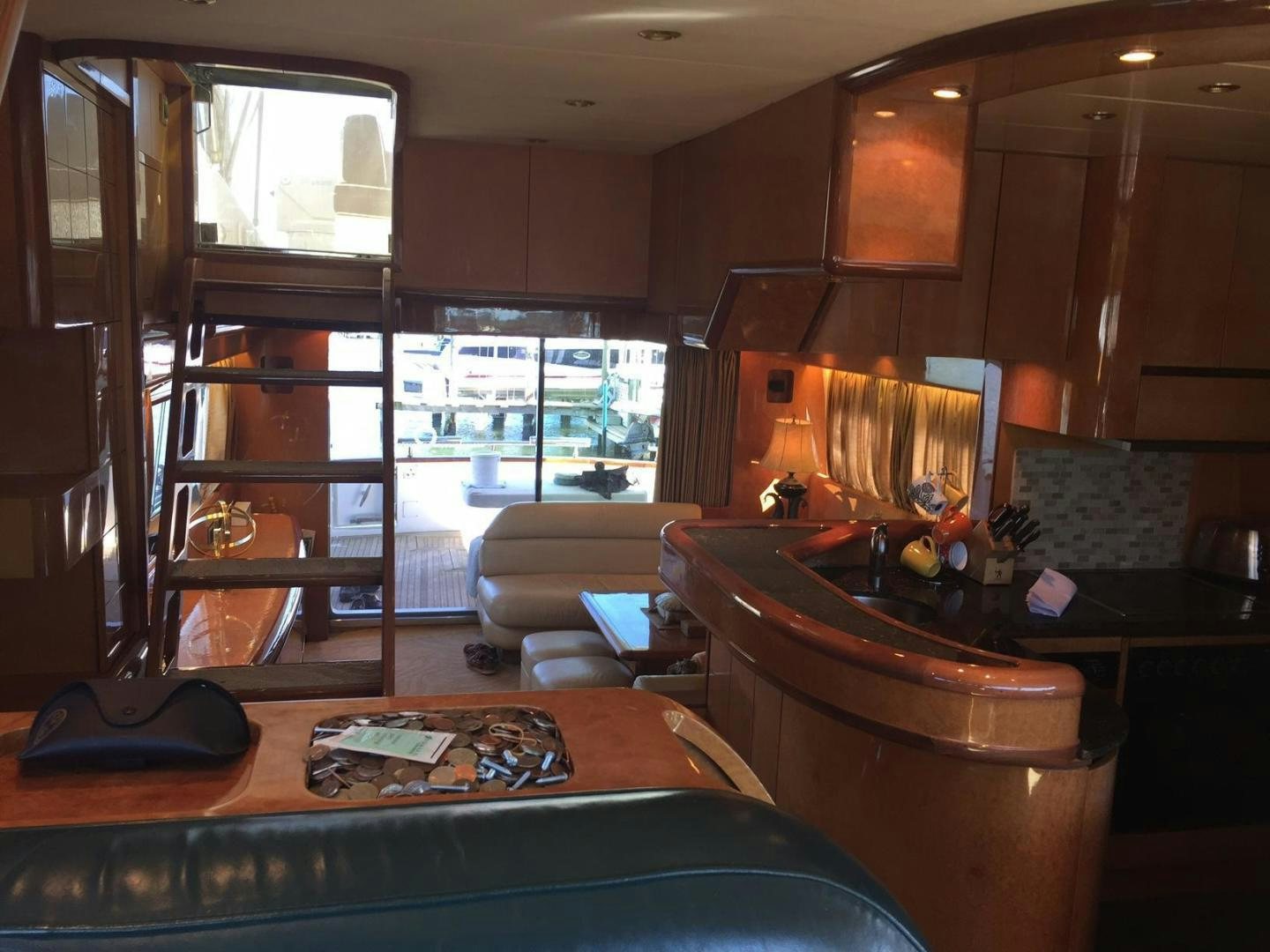 a living room with a fireplace aboard UNZIPPED Yacht for Sale