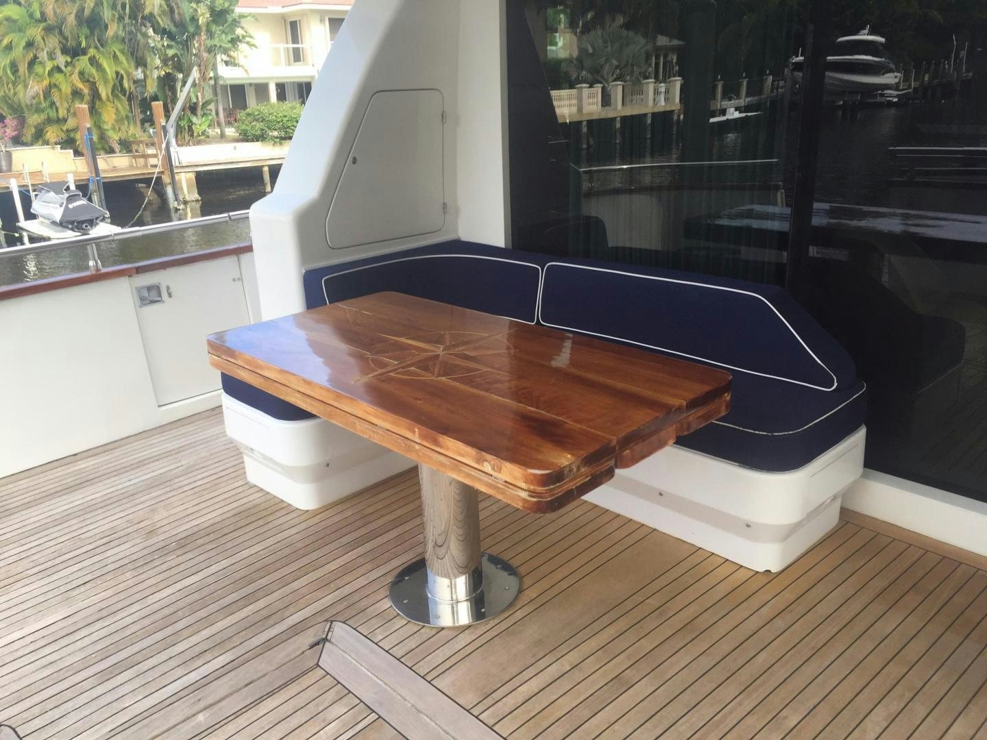 a table on a deck aboard UNZIPPED Yacht for Sale