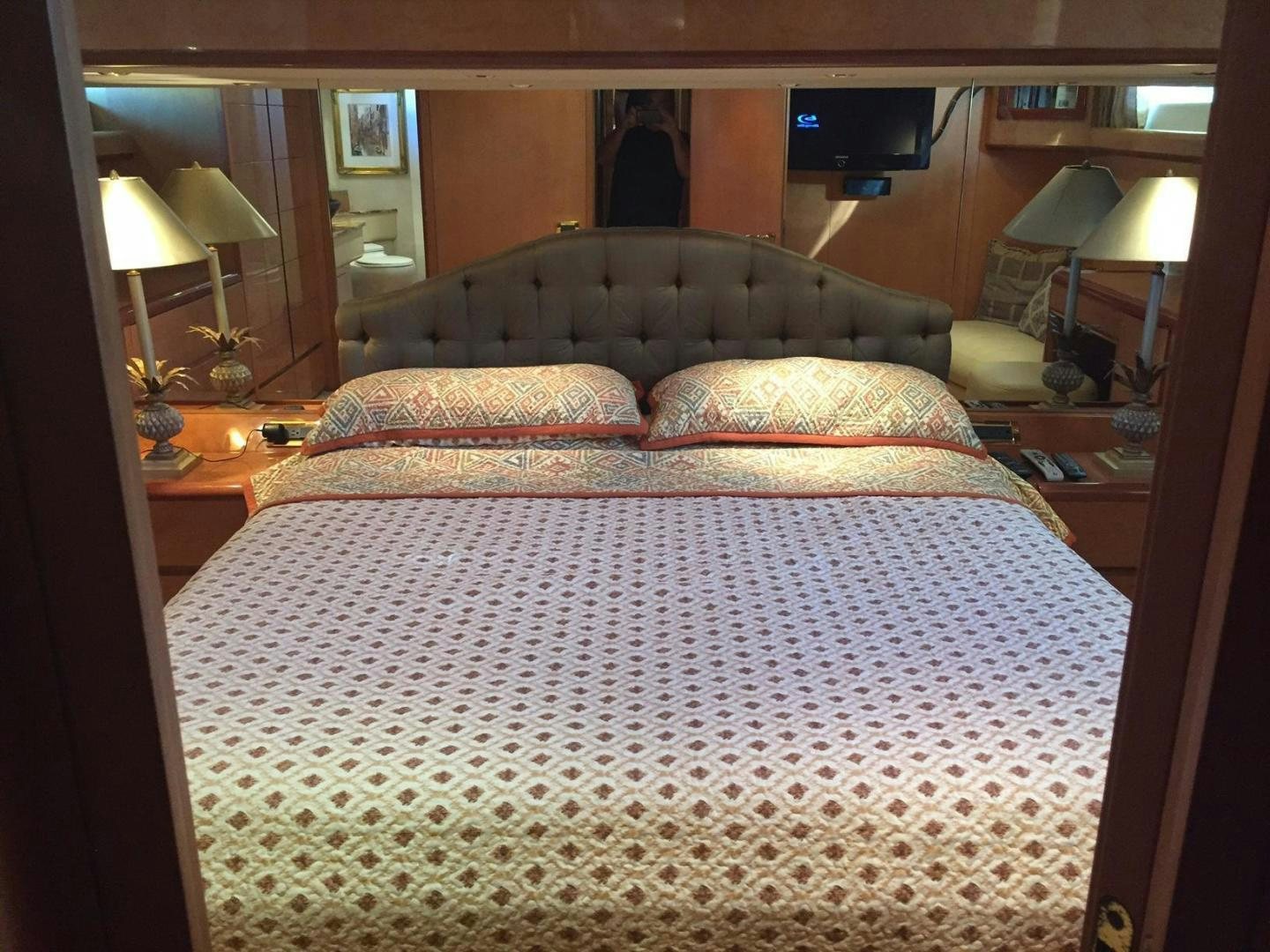 a bed with a large bed aboard UNZIPPED Yacht for Sale