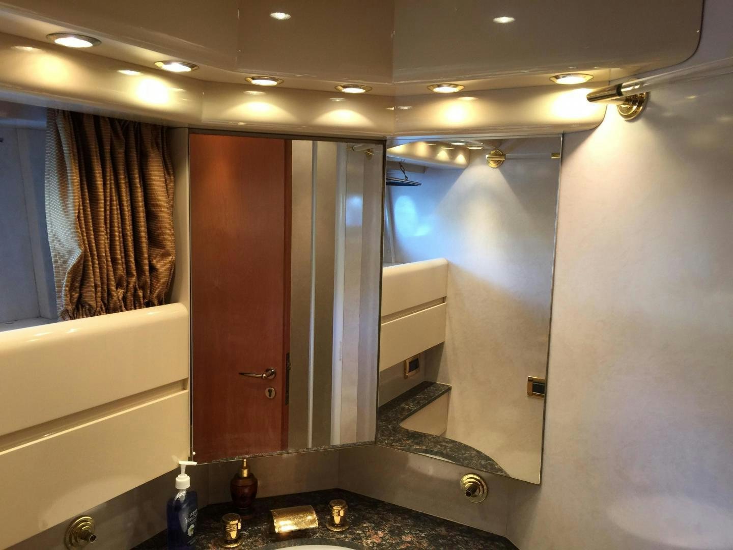 a bathroom with a sink and cabinets aboard UNZIPPED Yacht for Sale