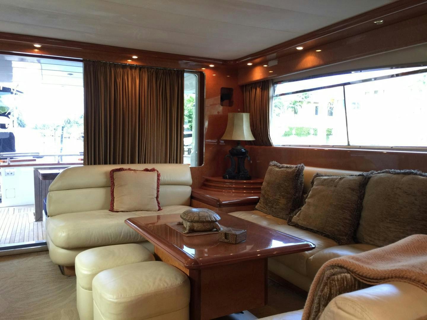 a living room with a couch and a coffee table aboard UNZIPPED Yacht for Sale