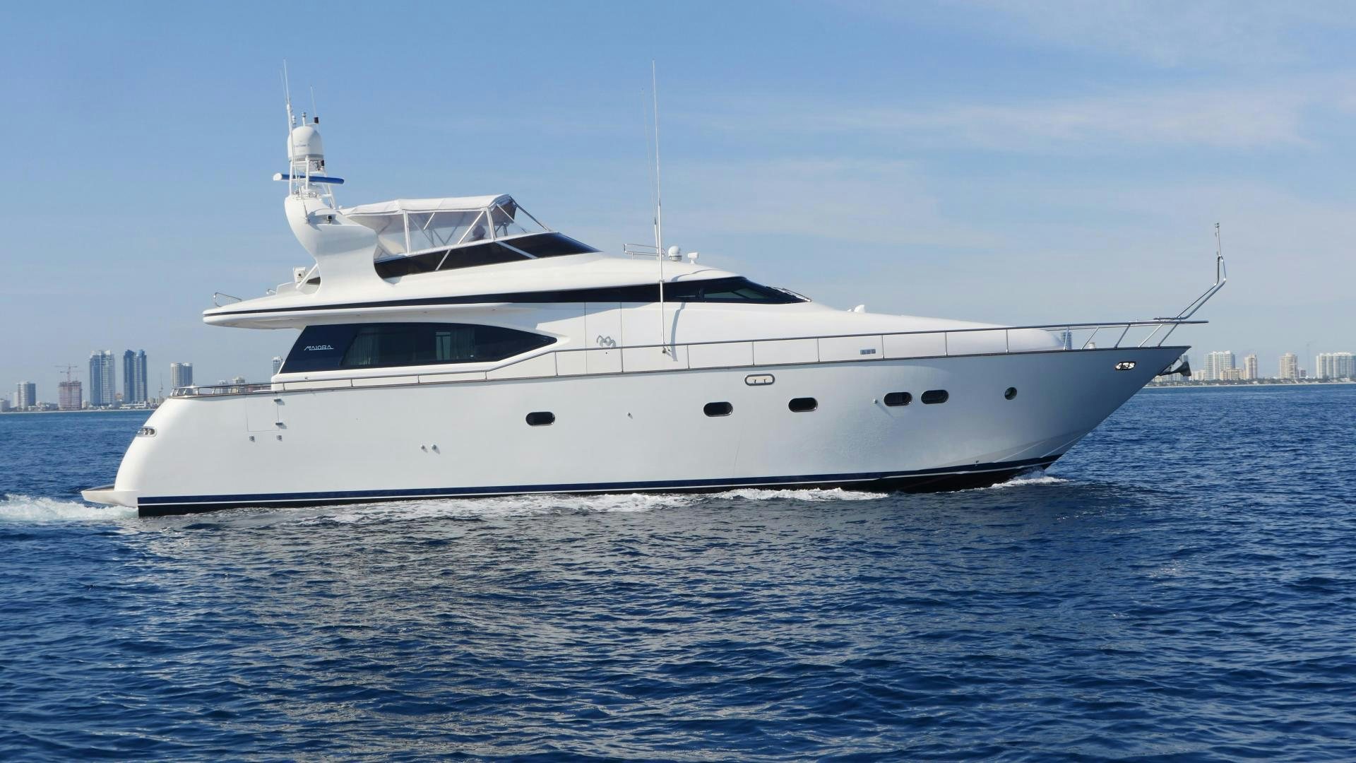 a white yacht in the water aboard UNZIPPED Yacht for Sale