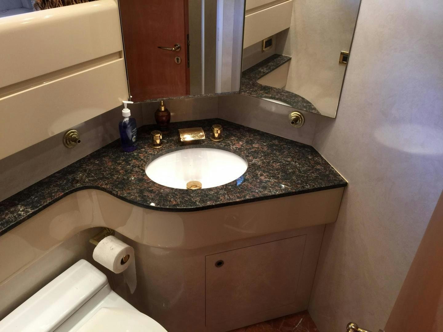 a bathroom sink with a marble counter top aboard UNZIPPED Yacht for Sale