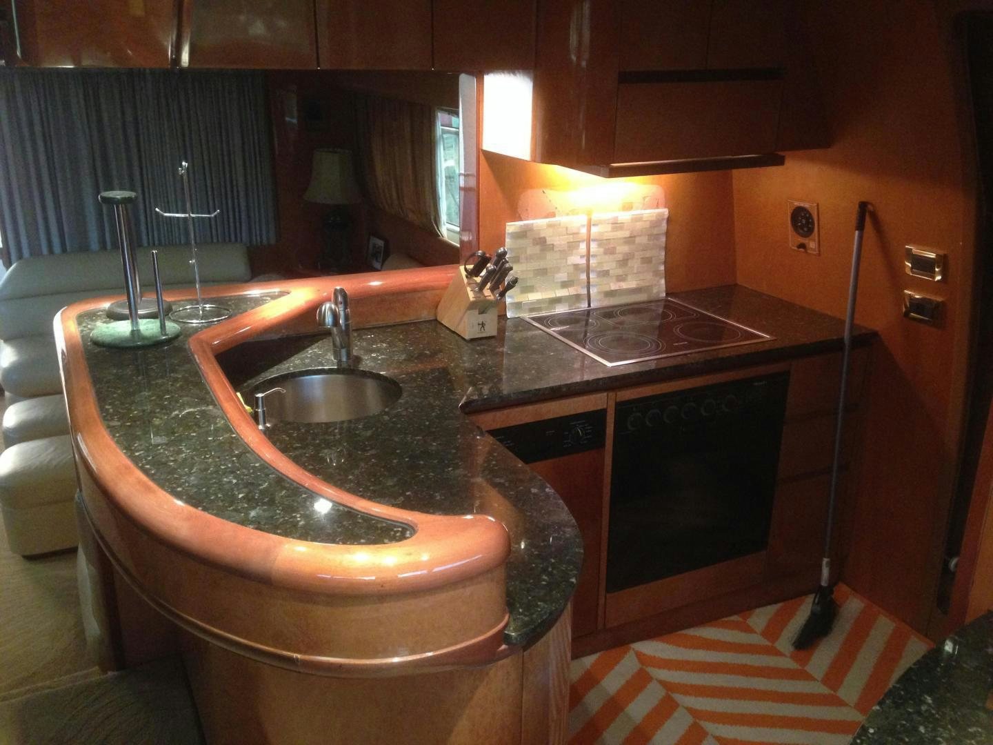 a kitchen with a sink and a large countertop aboard UNZIPPED Yacht for Sale