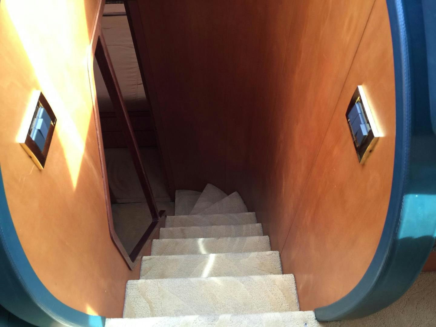 a staircase with a white carpet aboard UNZIPPED Yacht for Sale