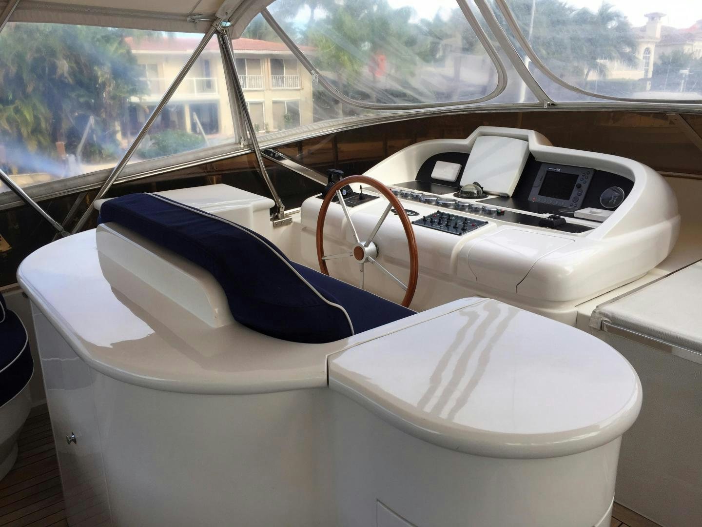 a white car with a steering wheel aboard UNZIPPED Yacht for Sale