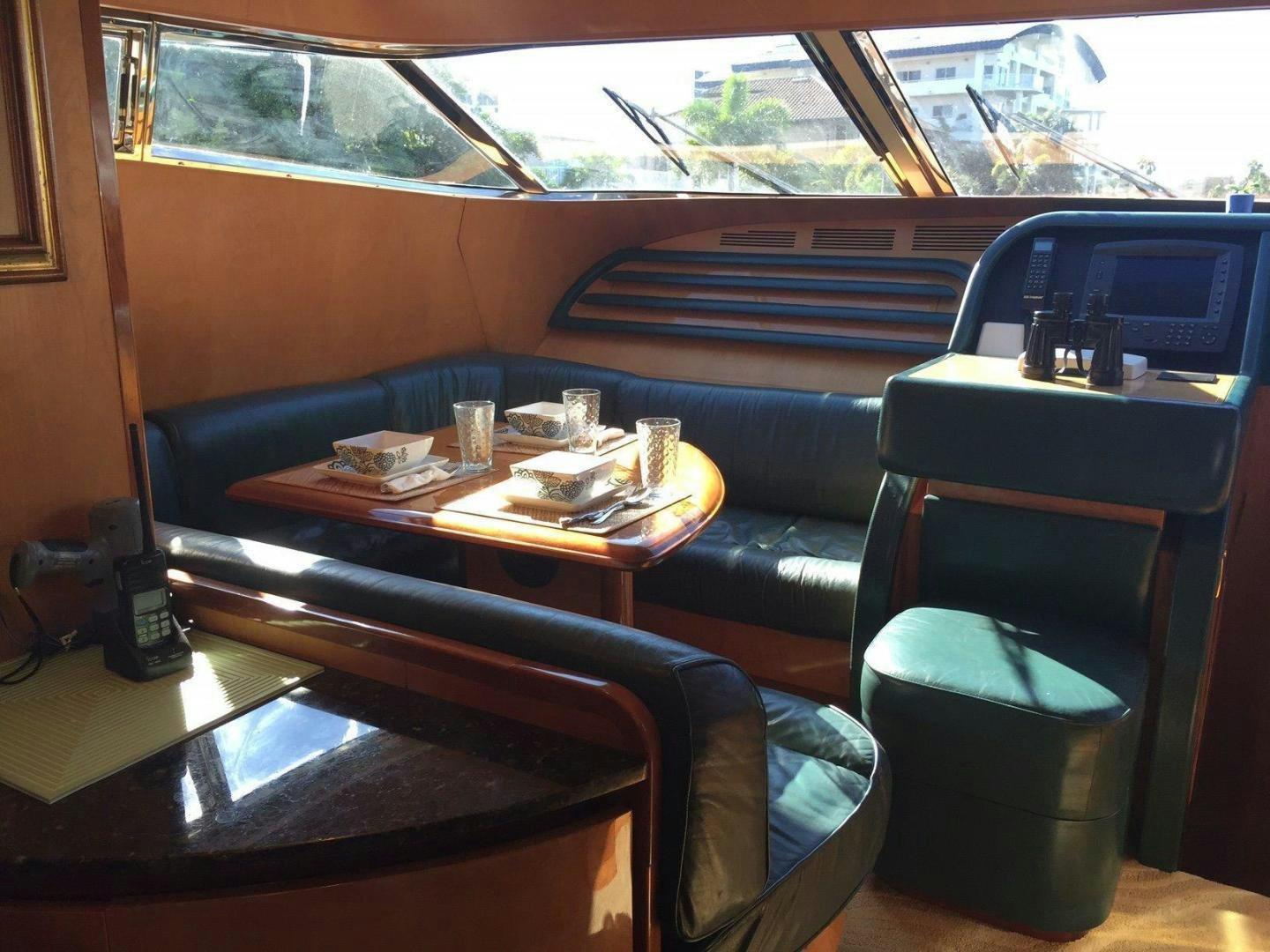 a table with a plate of food on it aboard UNZIPPED Yacht for Sale
