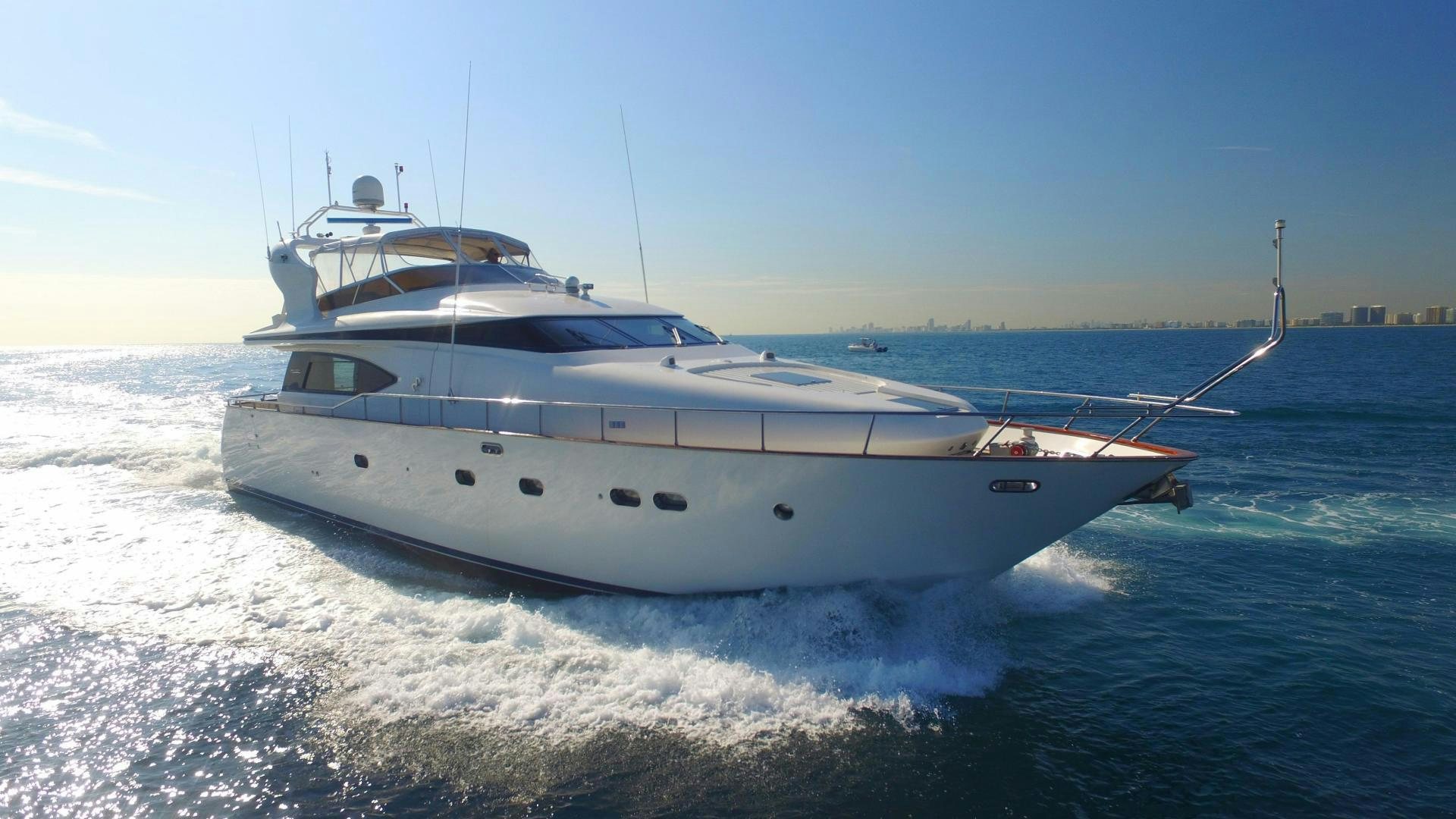 a white boat on the water aboard UNZIPPED Yacht for Sale