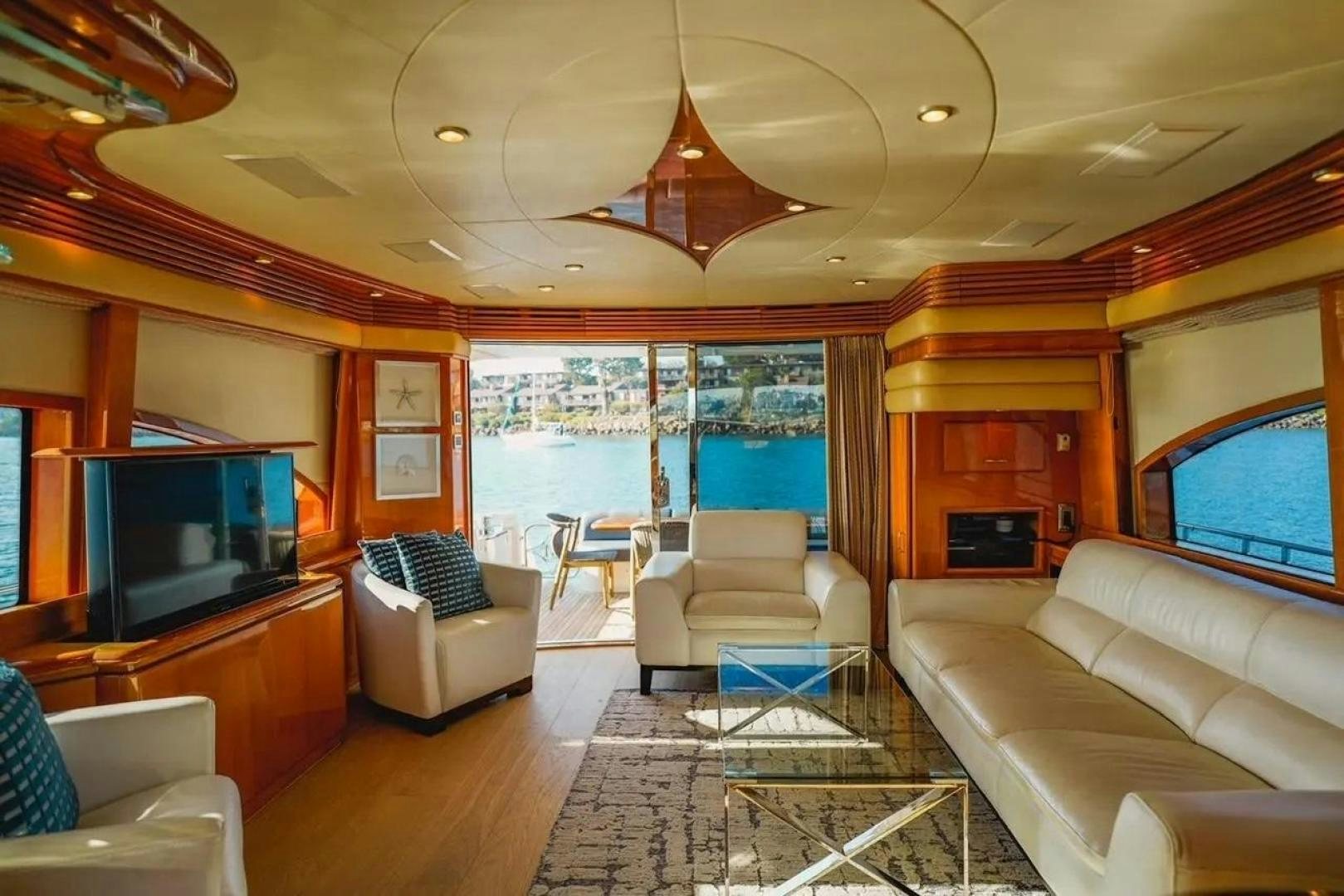 a living room with a large window aboard STARTING OVER Yacht for Sale