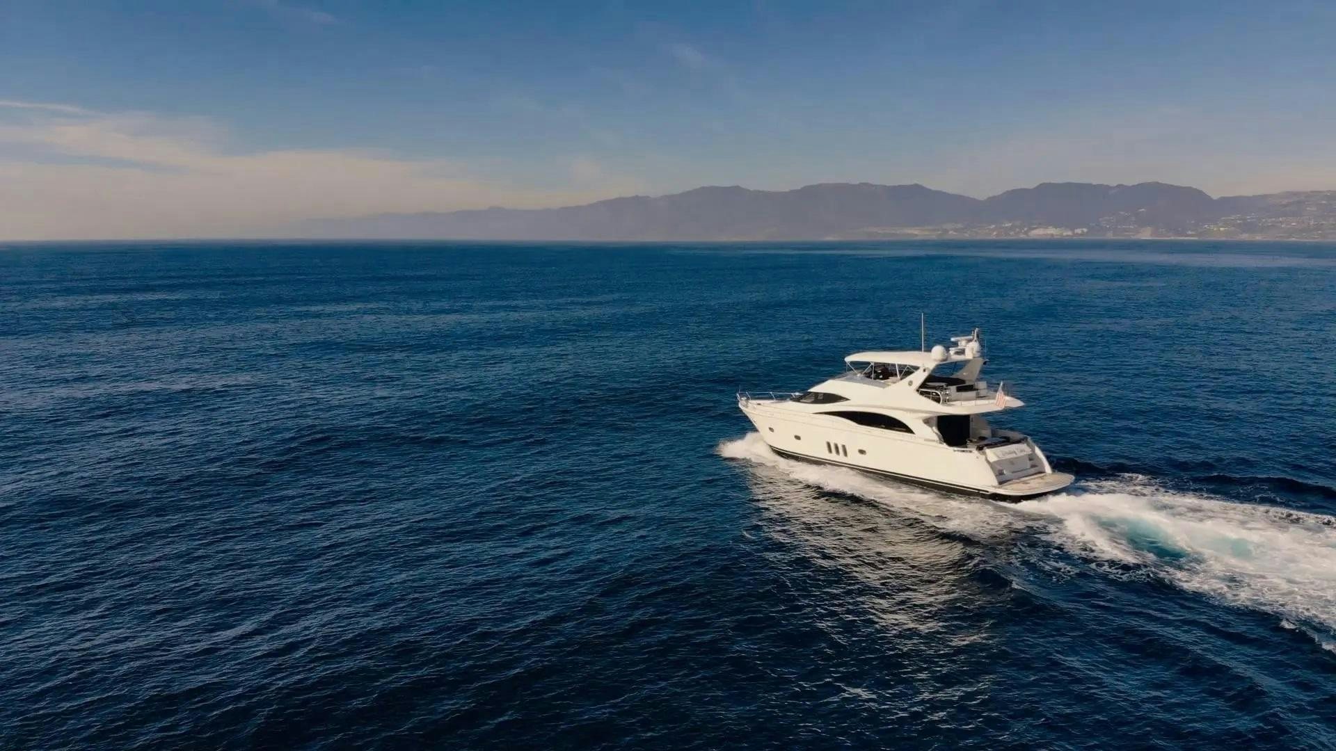 a white boat on the water aboard STARTING OVER Yacht for Sale