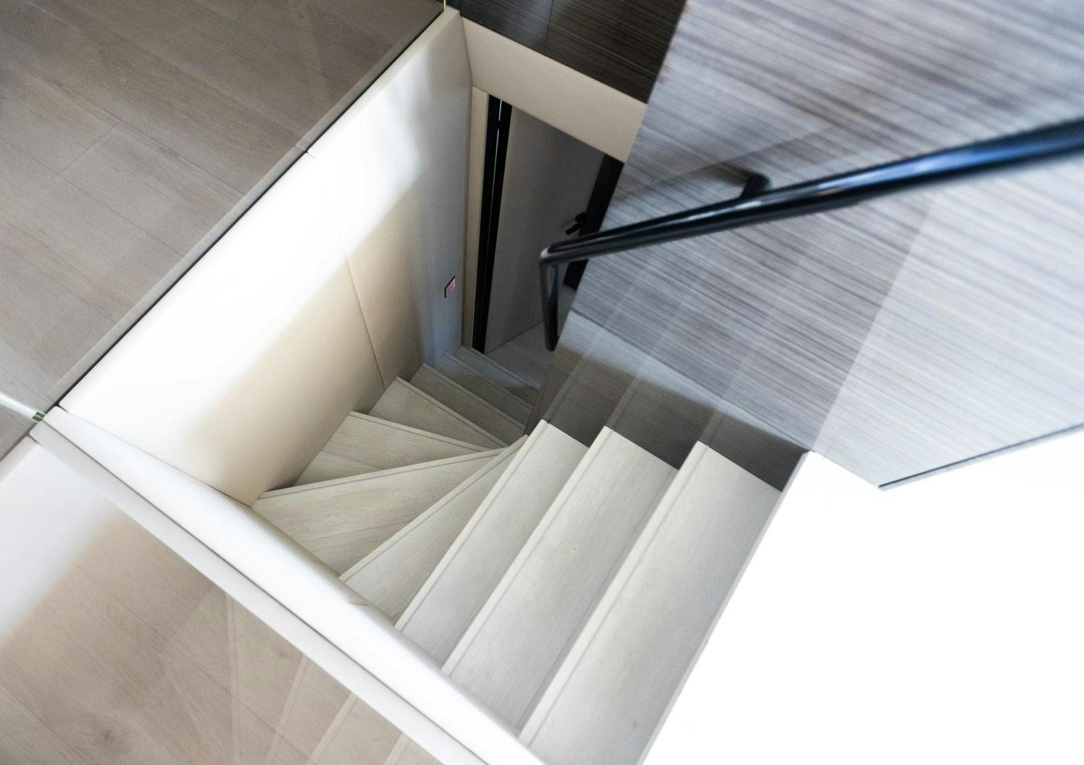 a white staircase with a railing aboard ROCK STAR 2.0 Yacht for Sale