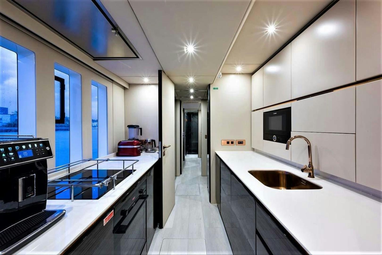a kitchen with a sink and a stove aboard ROCK STAR 2.0 Yacht for Sale