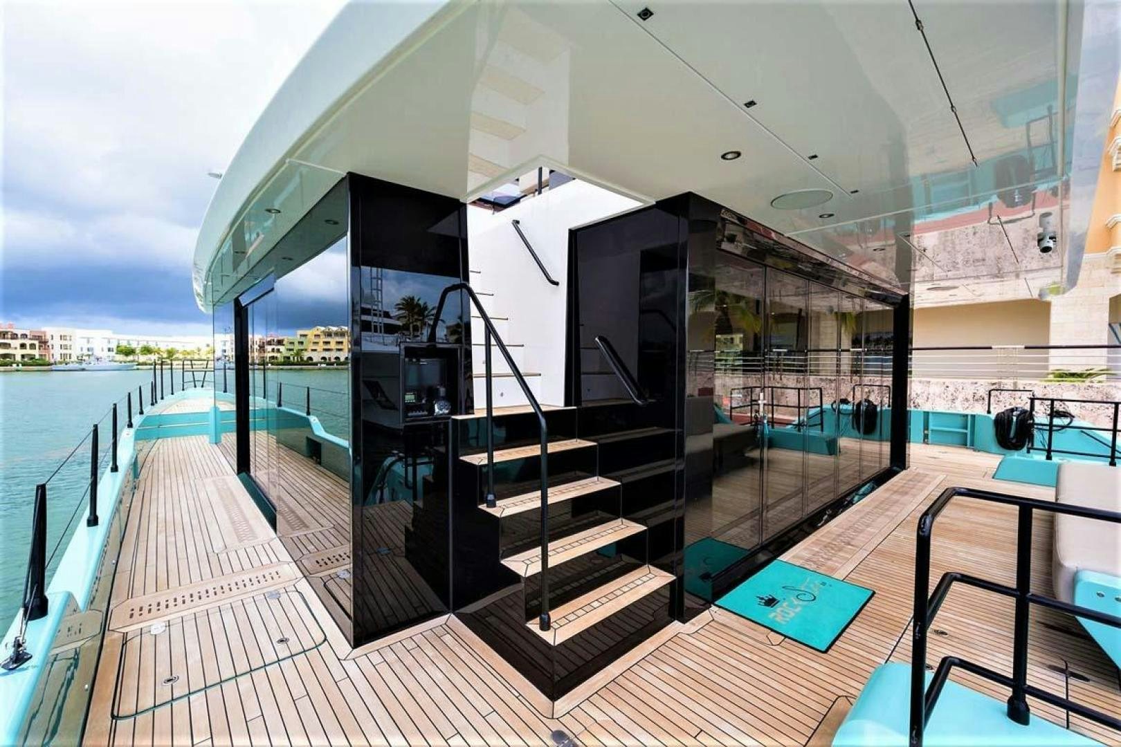 a deck with a large screen and a pool aboard ROCK STAR 2.0 Yacht for Sale