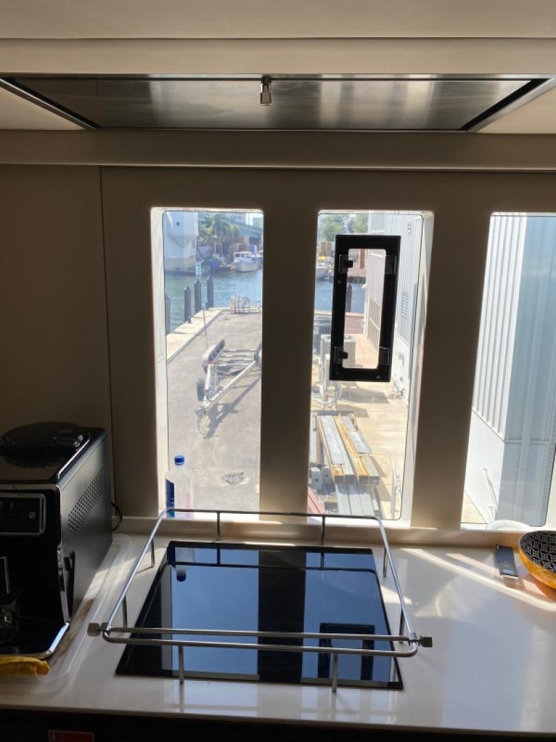 a window with a view of a city aboard ROCK STAR 2.0 Yacht for Sale