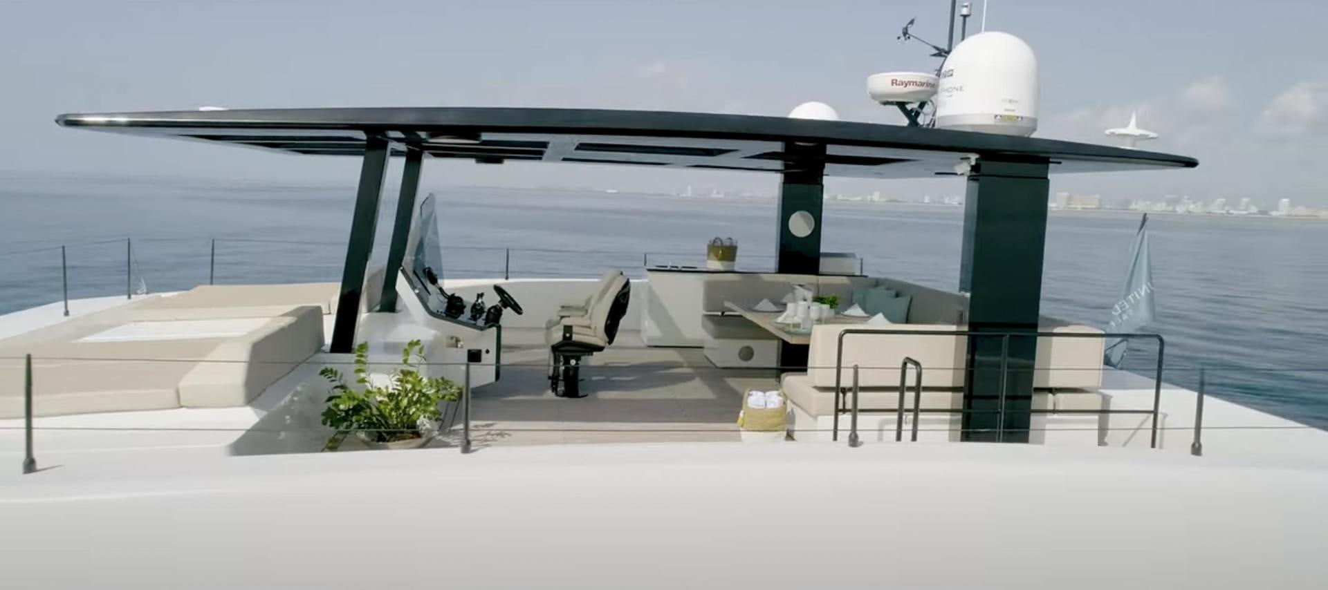 a large grey helicopter on a dock aboard ROCK STAR 2.0 Yacht for Sale